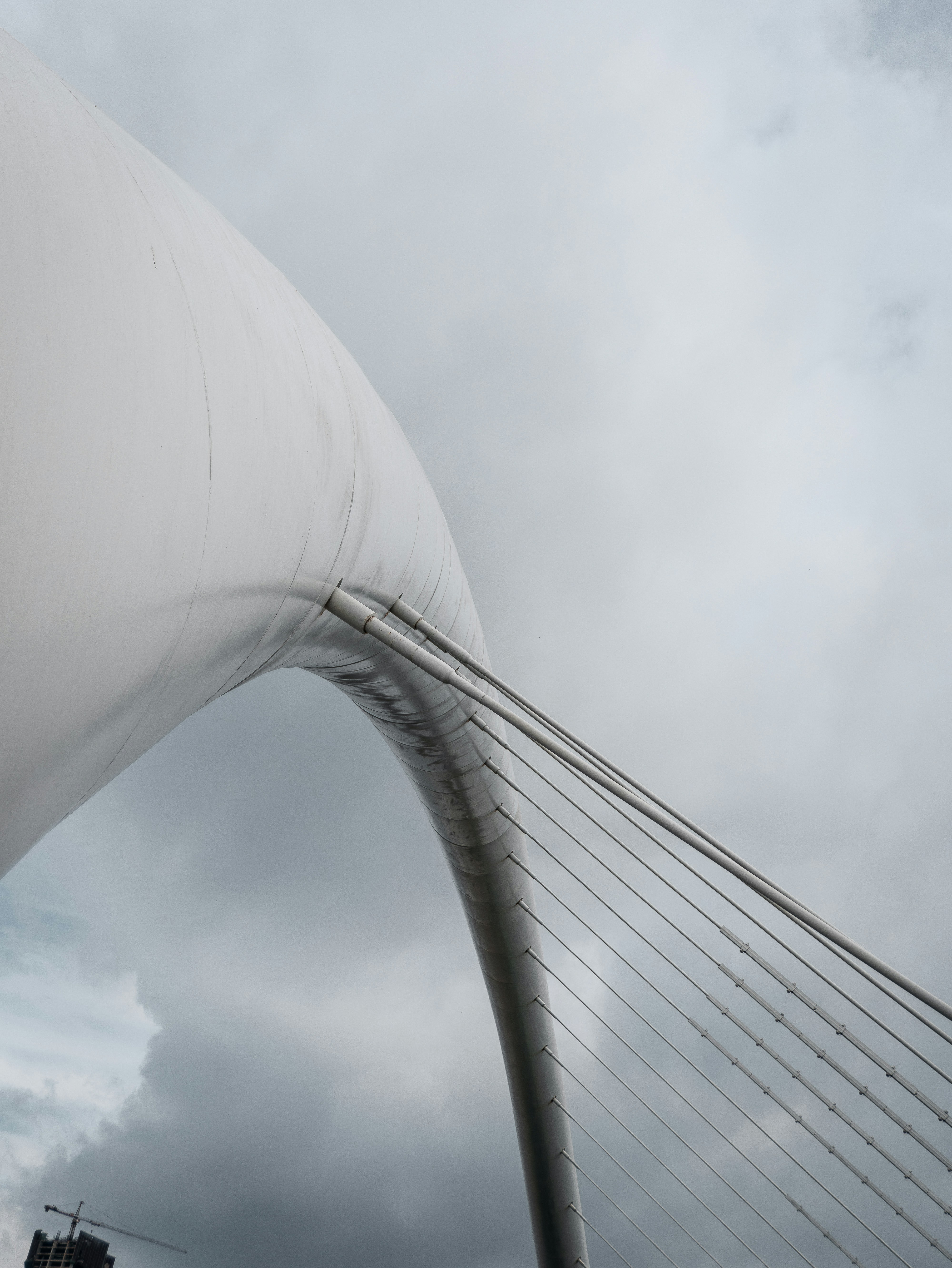 A very tall bridge with a very tall white structure