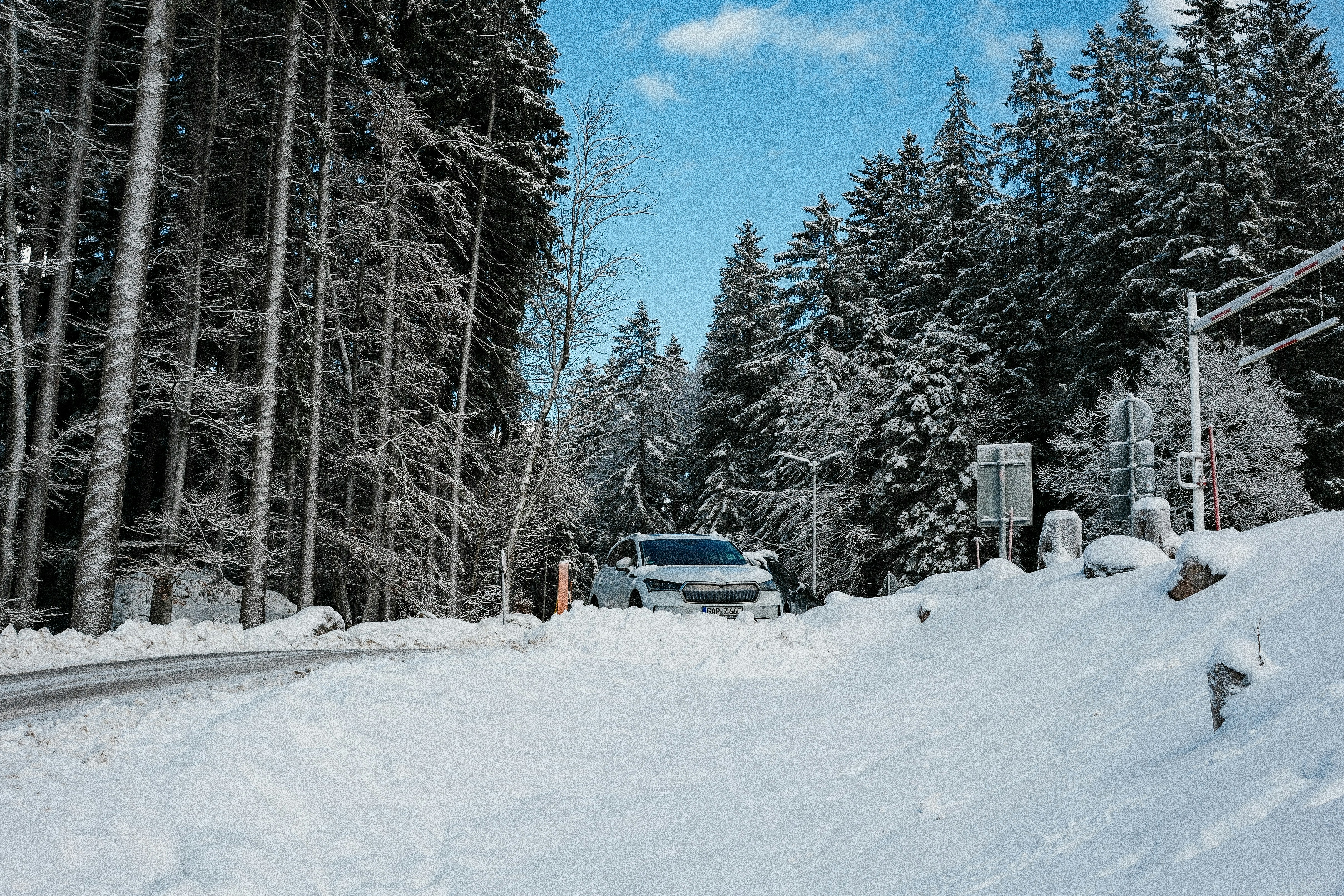 A car driving down a snow covered road