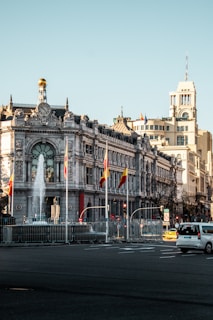A large building with a fountain in front of it