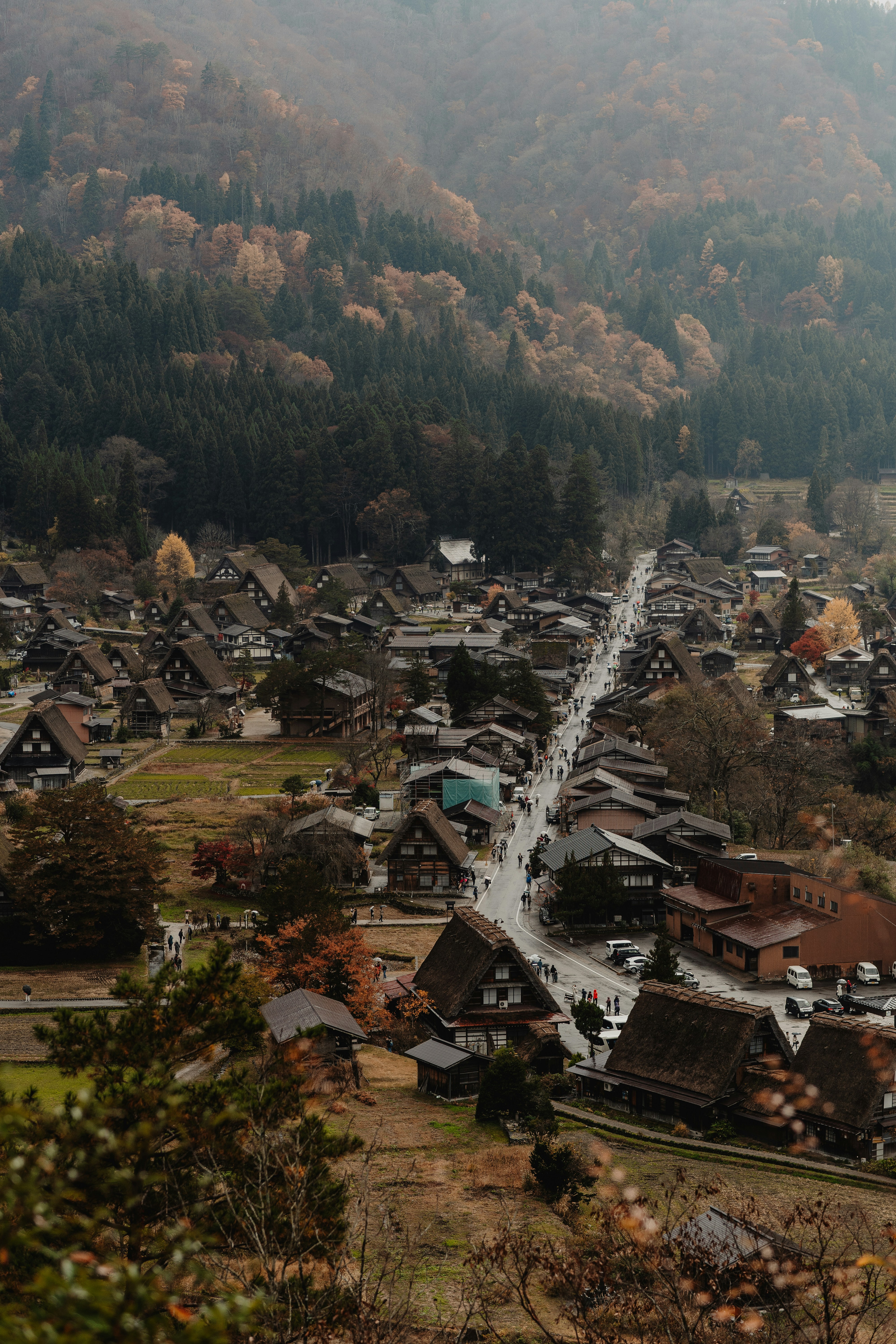 A village in the middle of a valley surrounded by mountains