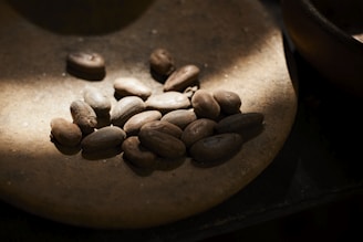 A close up of some coffee beans on a table