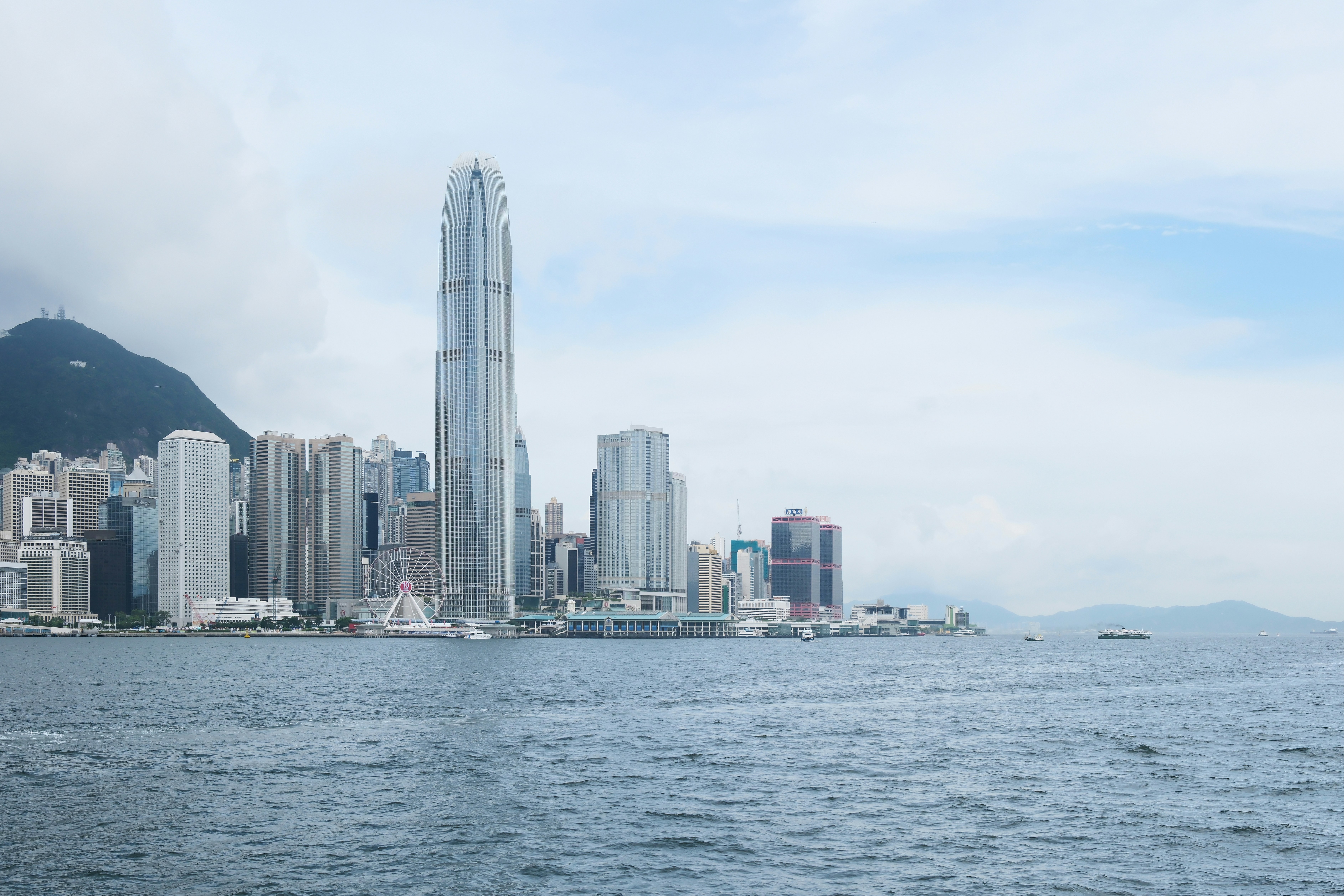 A large body of water with a city in the background