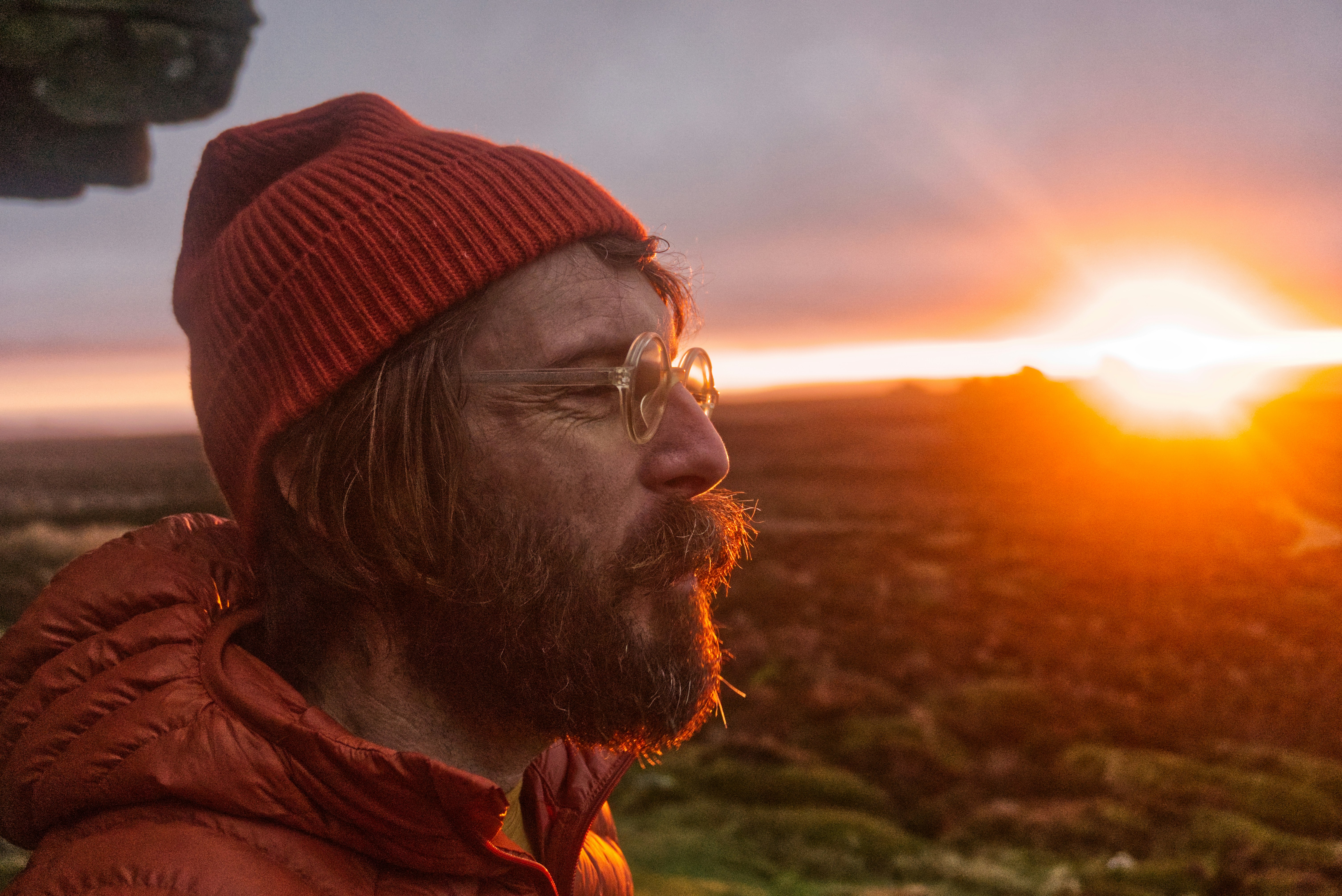 A man wearing a red hat and a red jacket