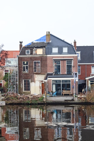 A body of water next to a row of houses
