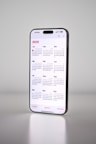 A phone with a calendar on the back of it