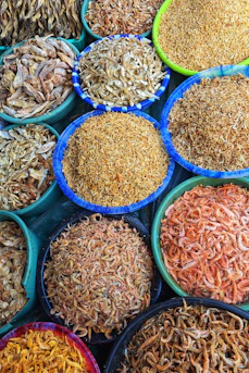 Many bowls of different types of food on display