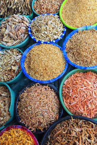 Many bowls of different types of food on display