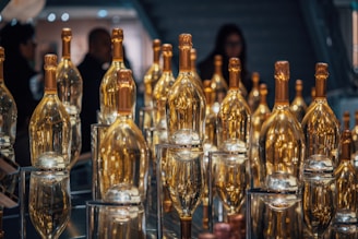 A table topped with lots of empty wine bottles
