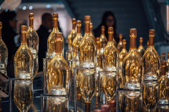 A table topped with lots of empty wine bottles