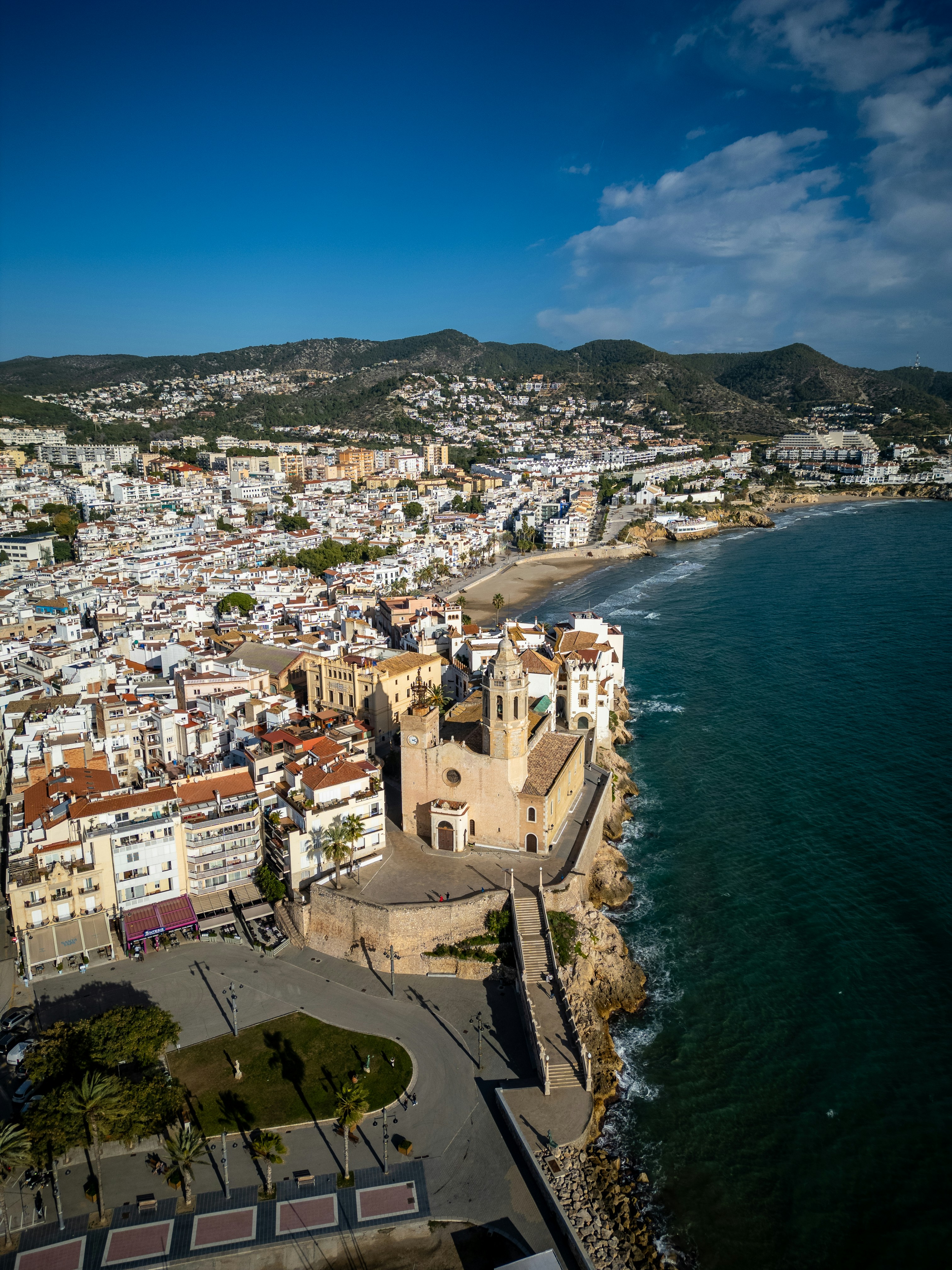 An aerial view of a city next to the ocean