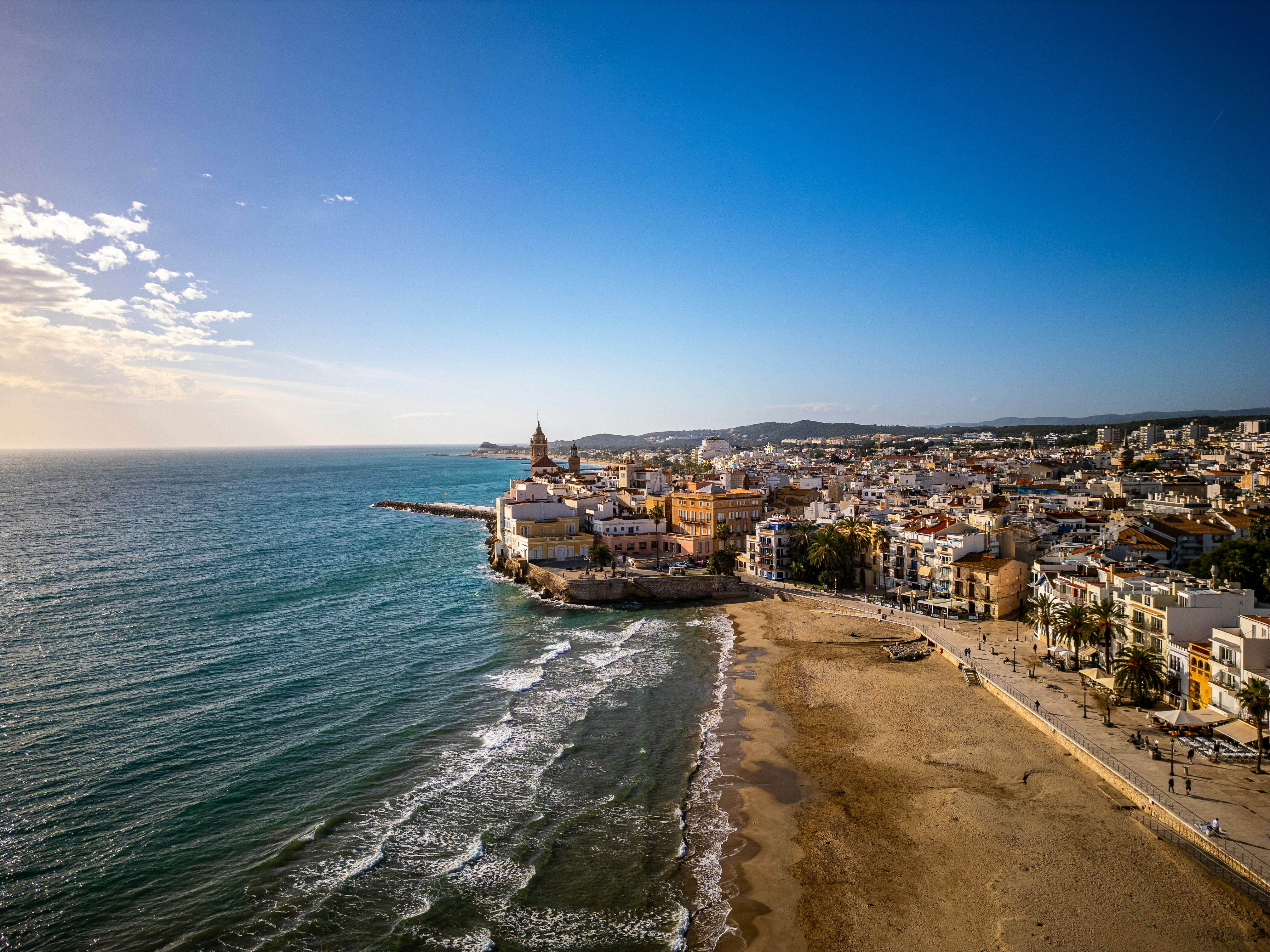 An aerial view of a beach and a city