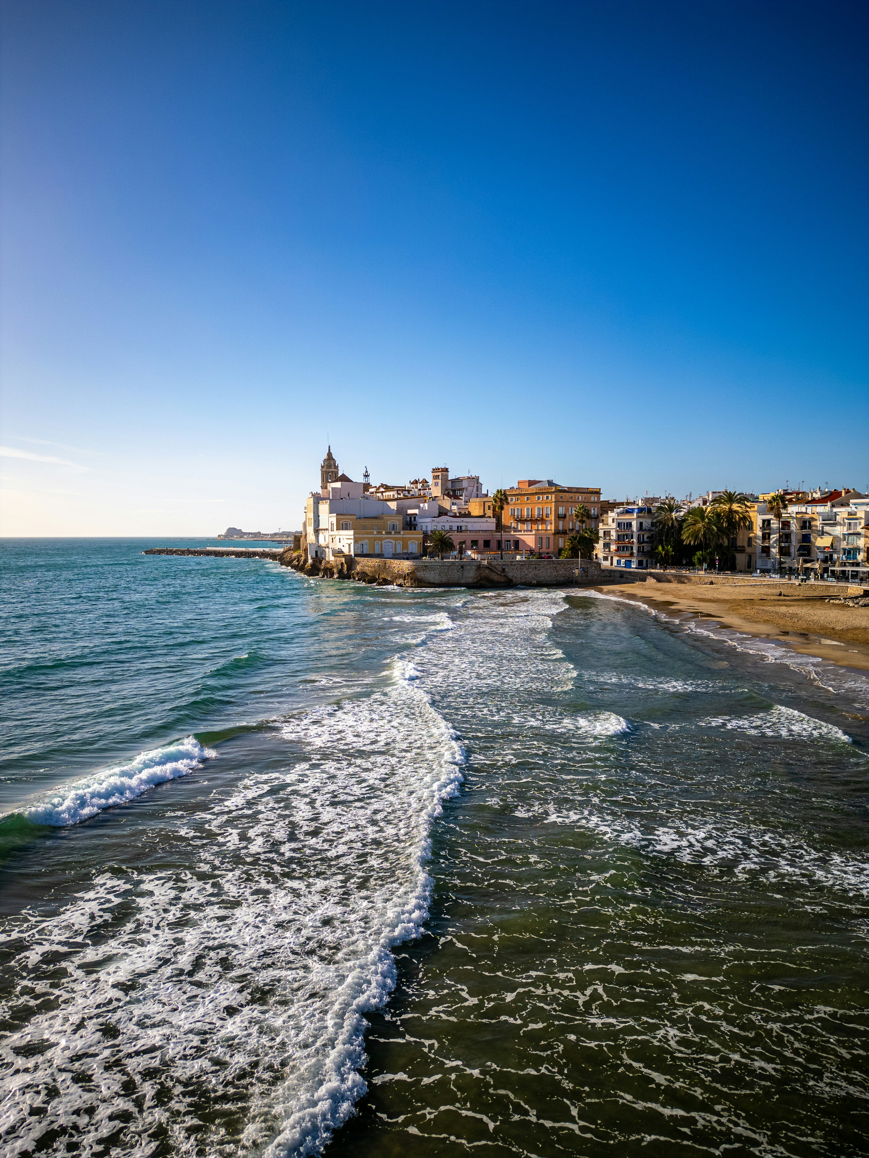 A view of a beach with buildings in the background