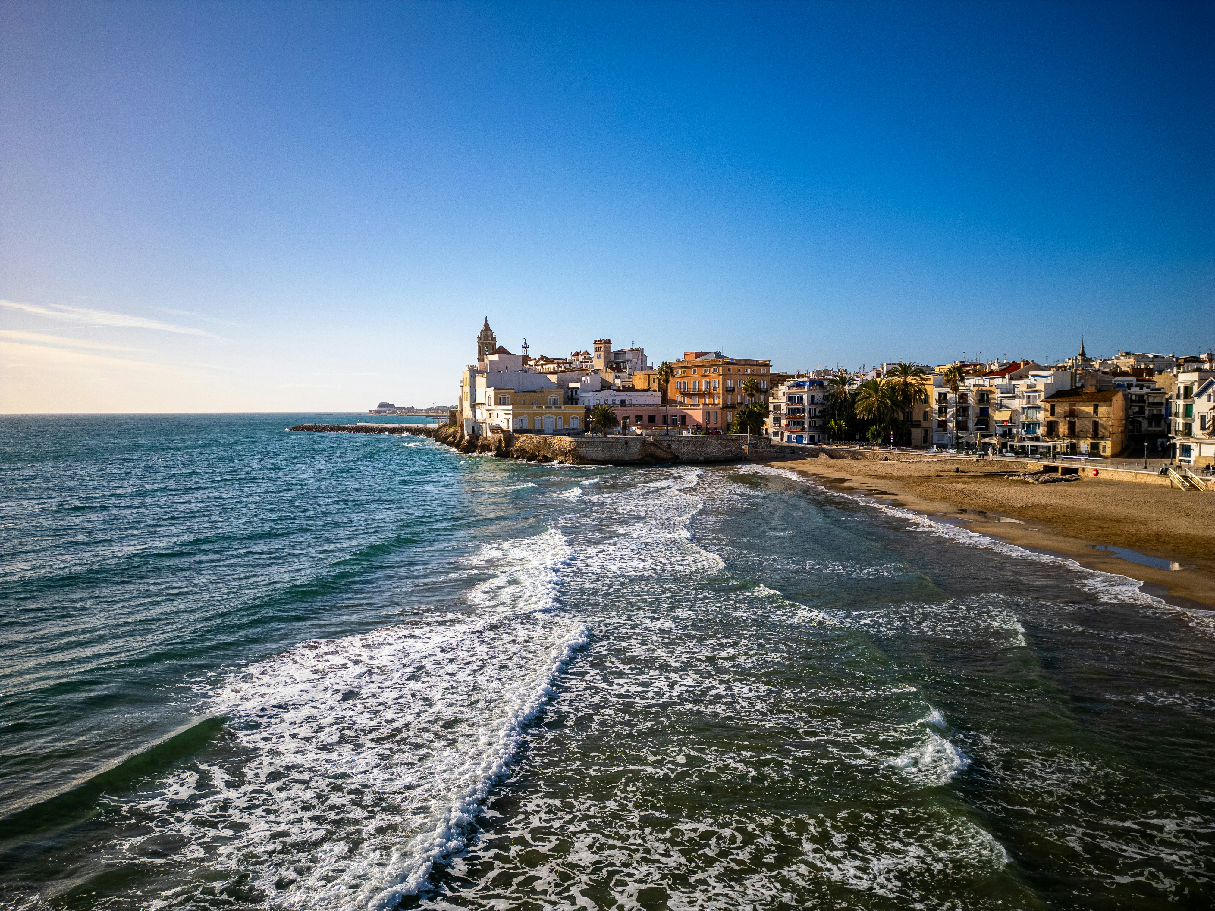 A view of a beach with a city in the background