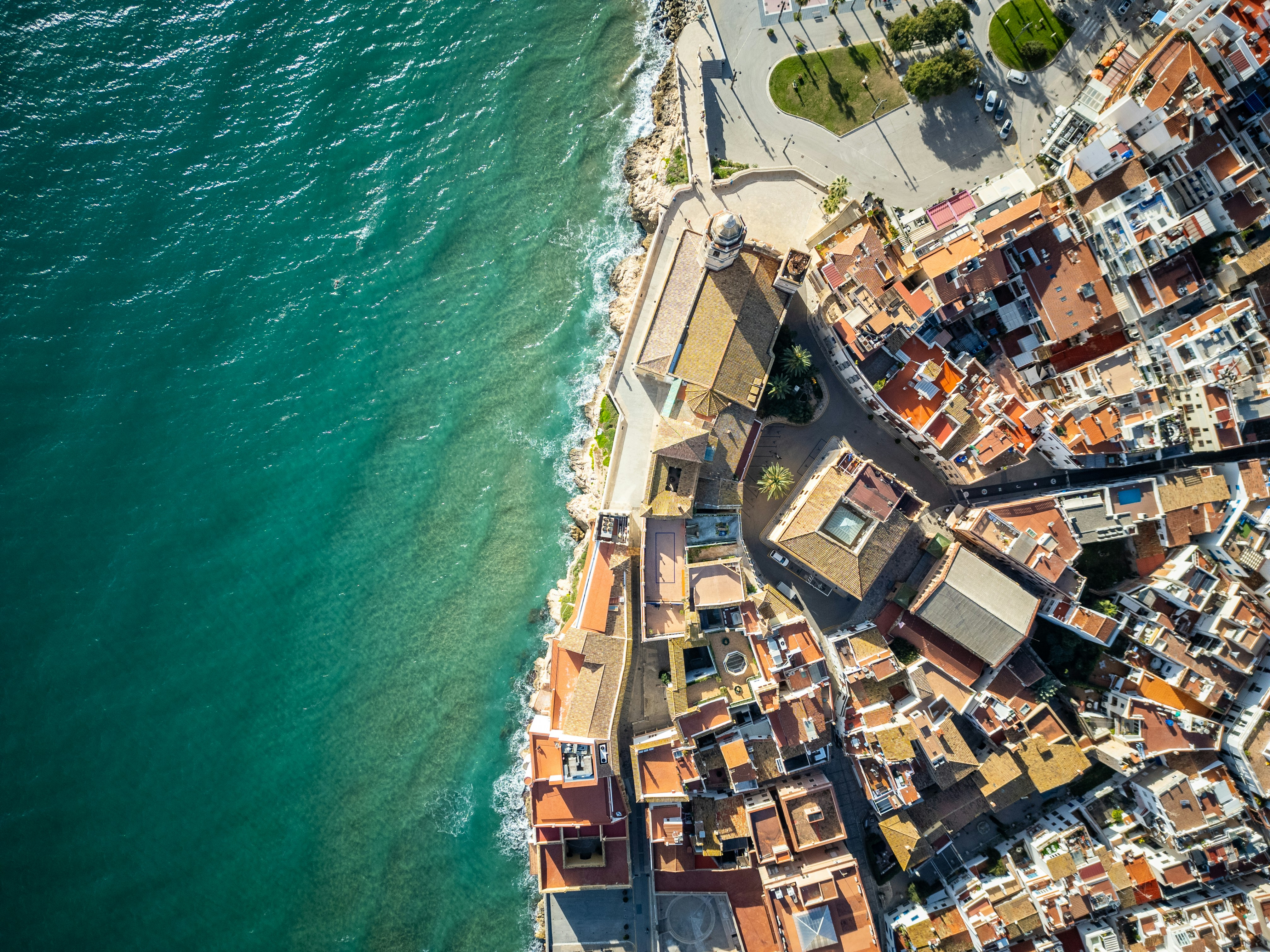 An aerial view of a city next to the ocean