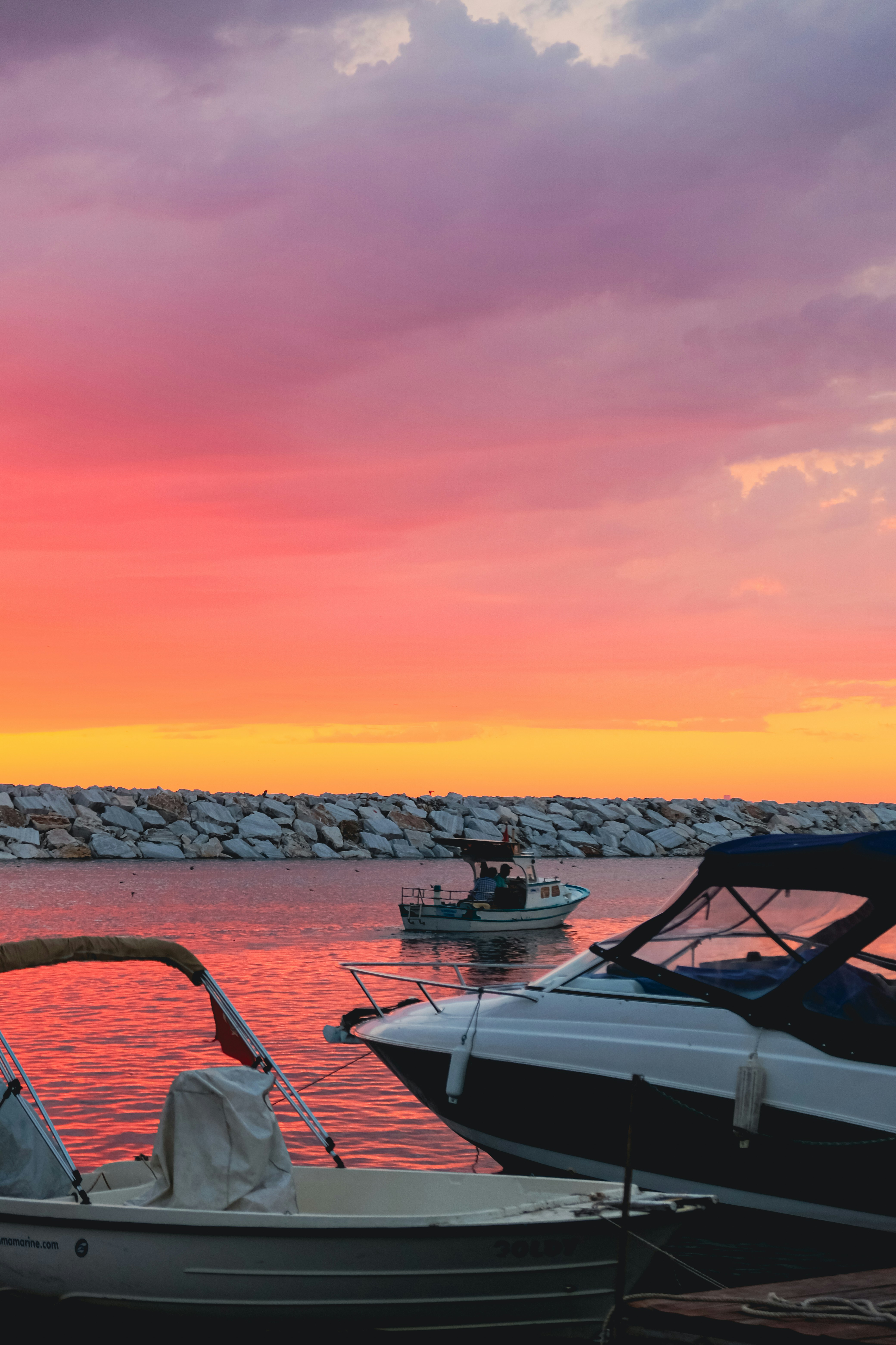 A couple of boats that are sitting in the water