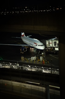A large jetliner sitting on top of an airport tarmac