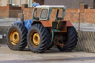 A large tractor parked on the side of a road on tractor tyres sold at tyrepublic in lagos nigeria