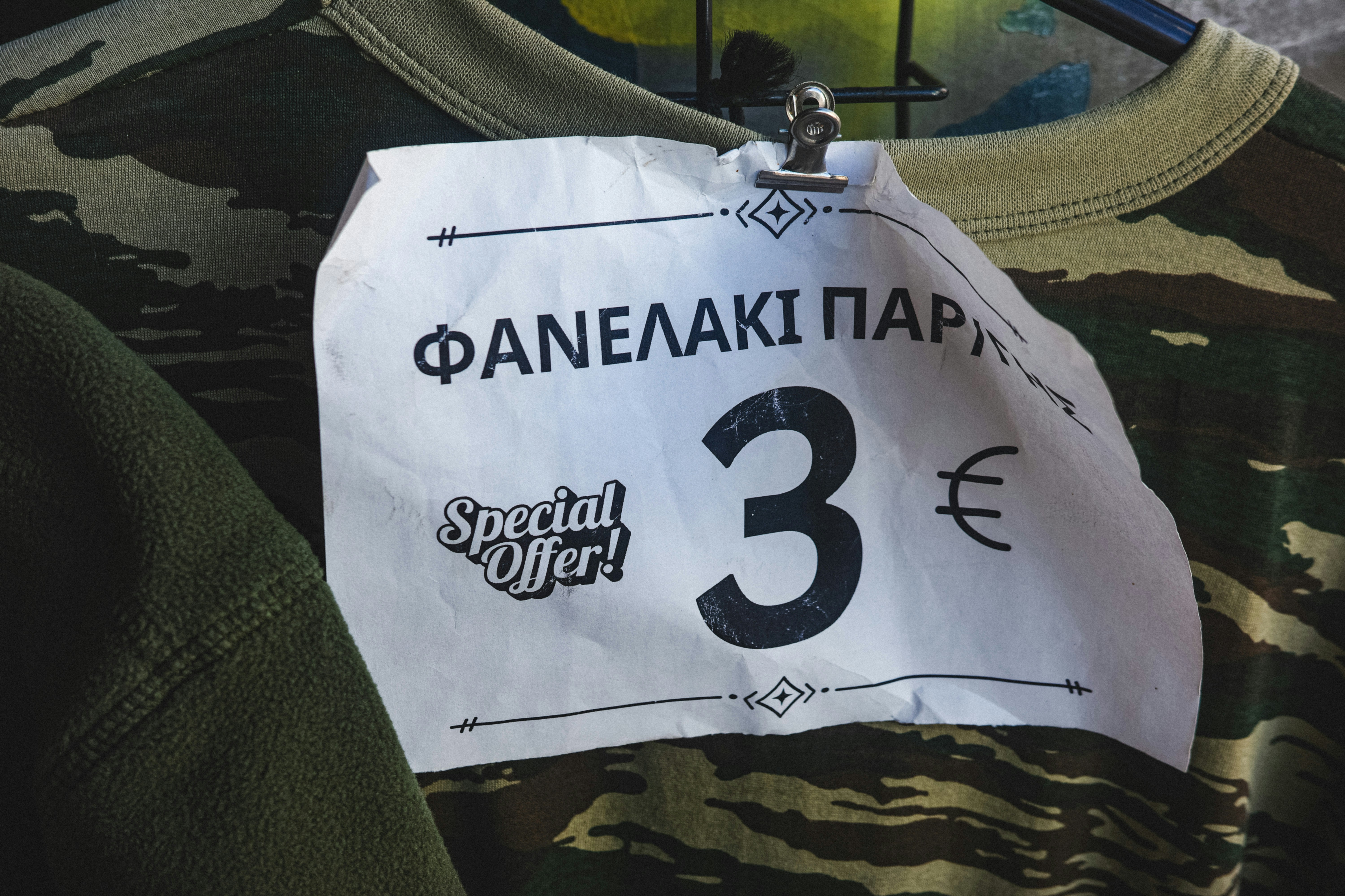 A shirt that has a price tag on it