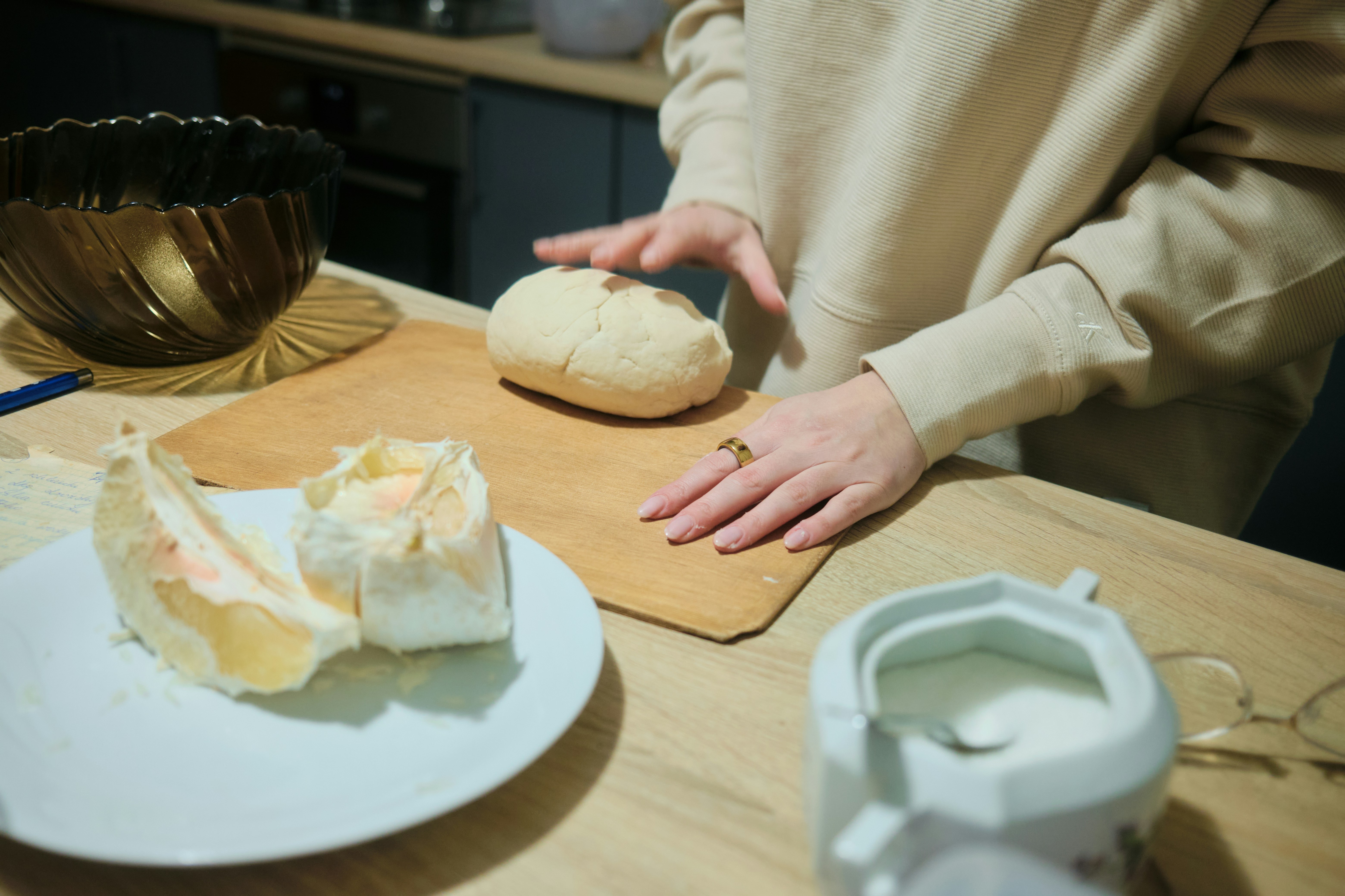 A person standing at a table with a plate of food