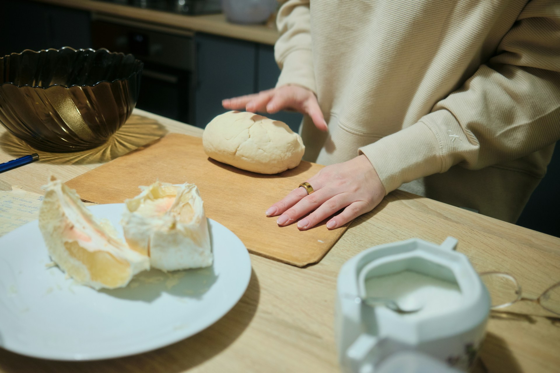 A person standing at a table with a plate of food