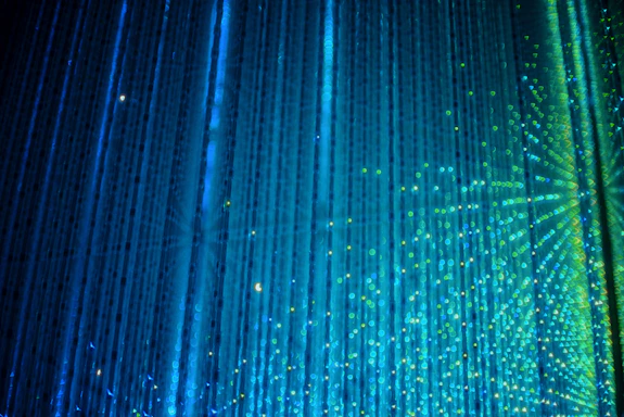 A shower head with a lot of water coming out of it