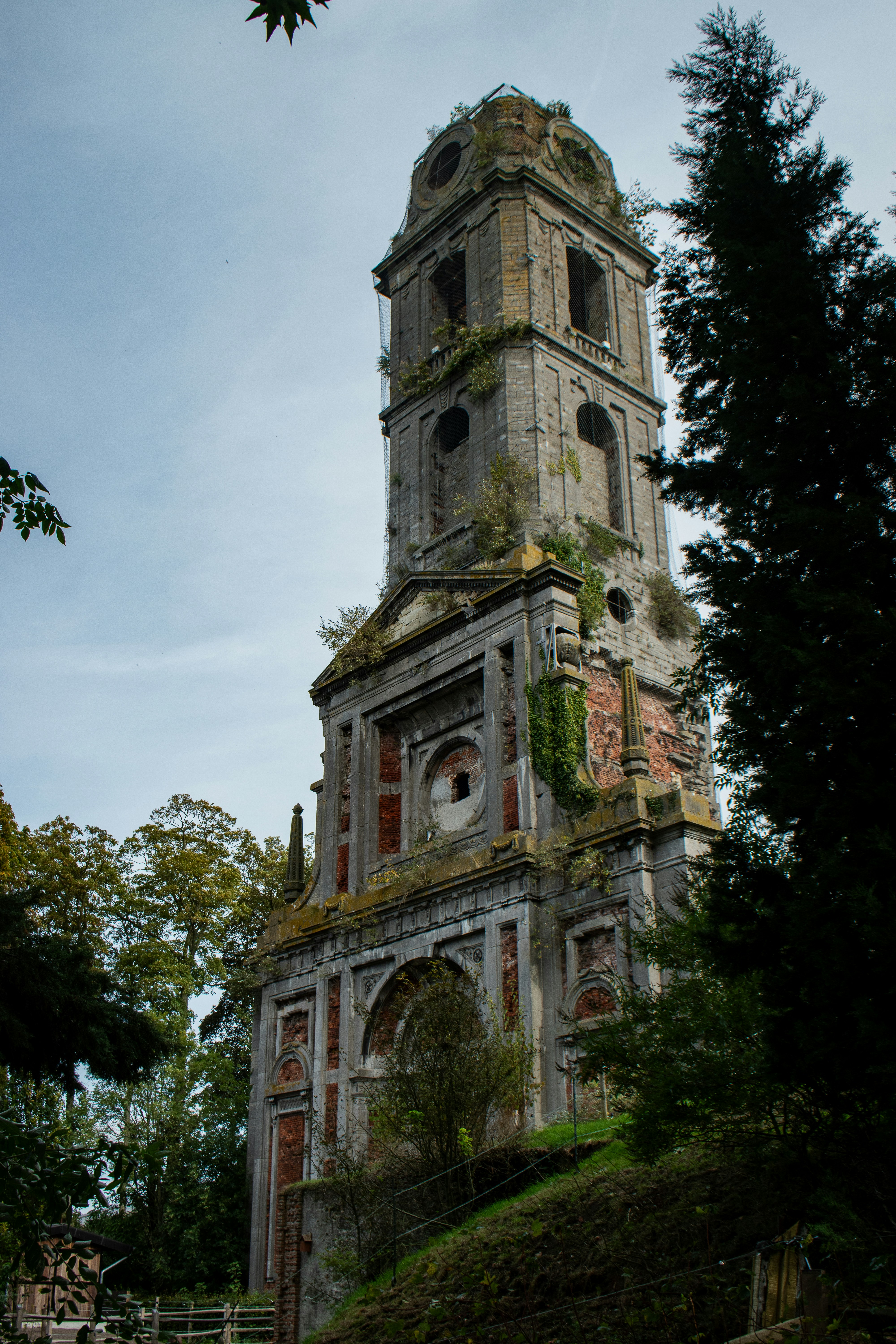 A very tall tower with a clock on it's side