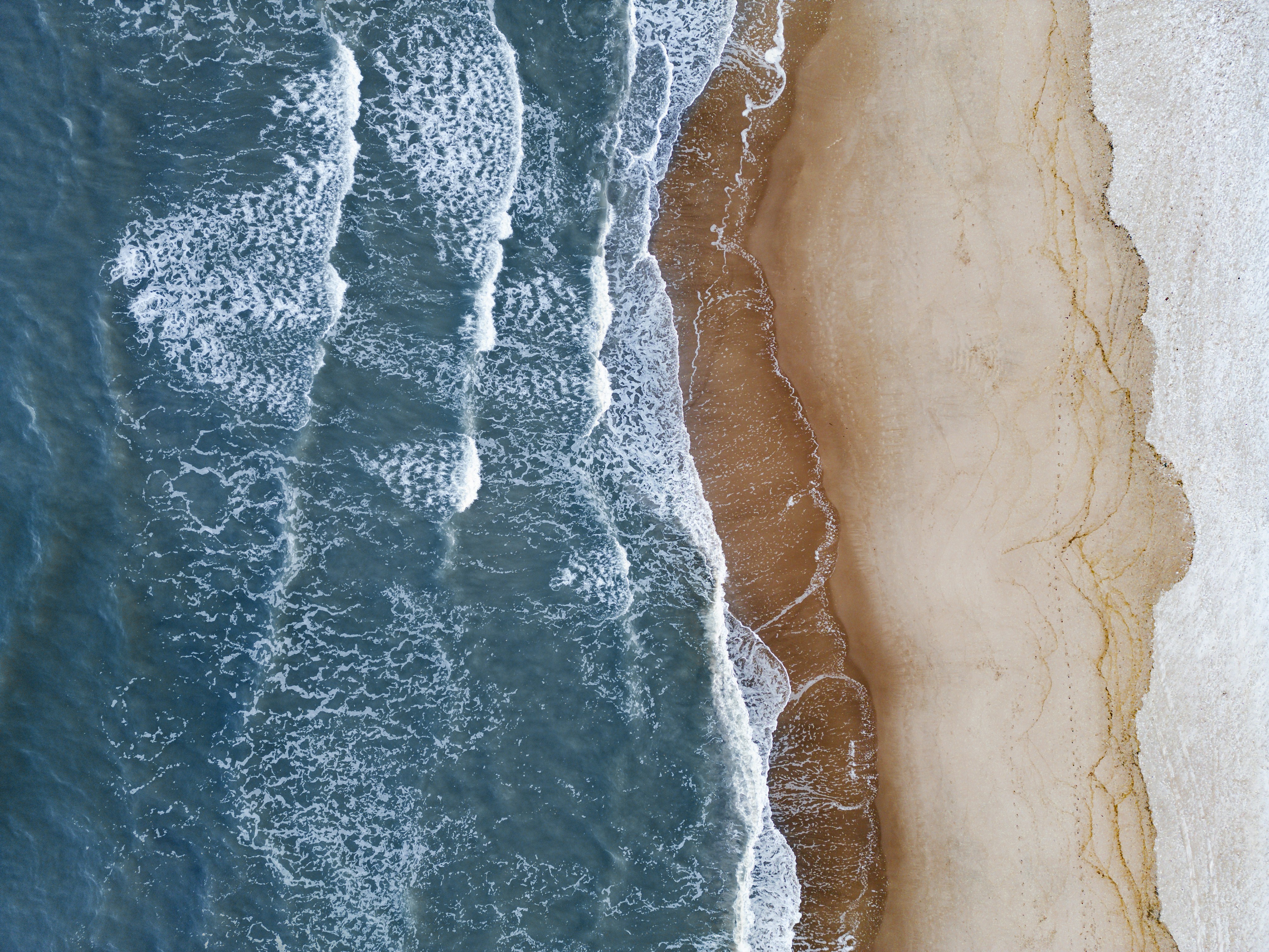 An aerial view of a beach and ocean