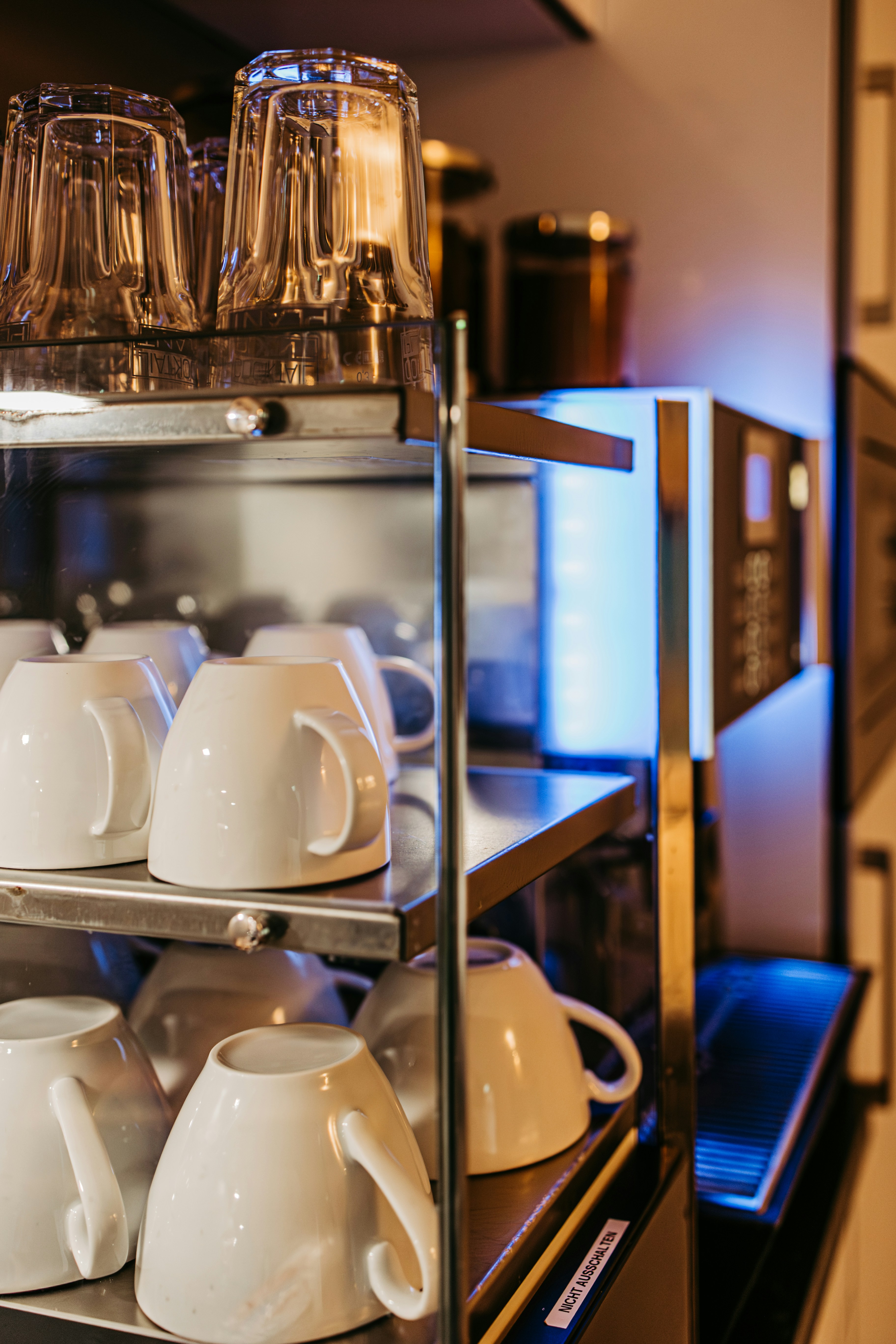 A display case filled with cups and saucers