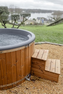 A hot tub sitting on top of a gravel field