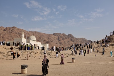 A large group of people standing in the desert