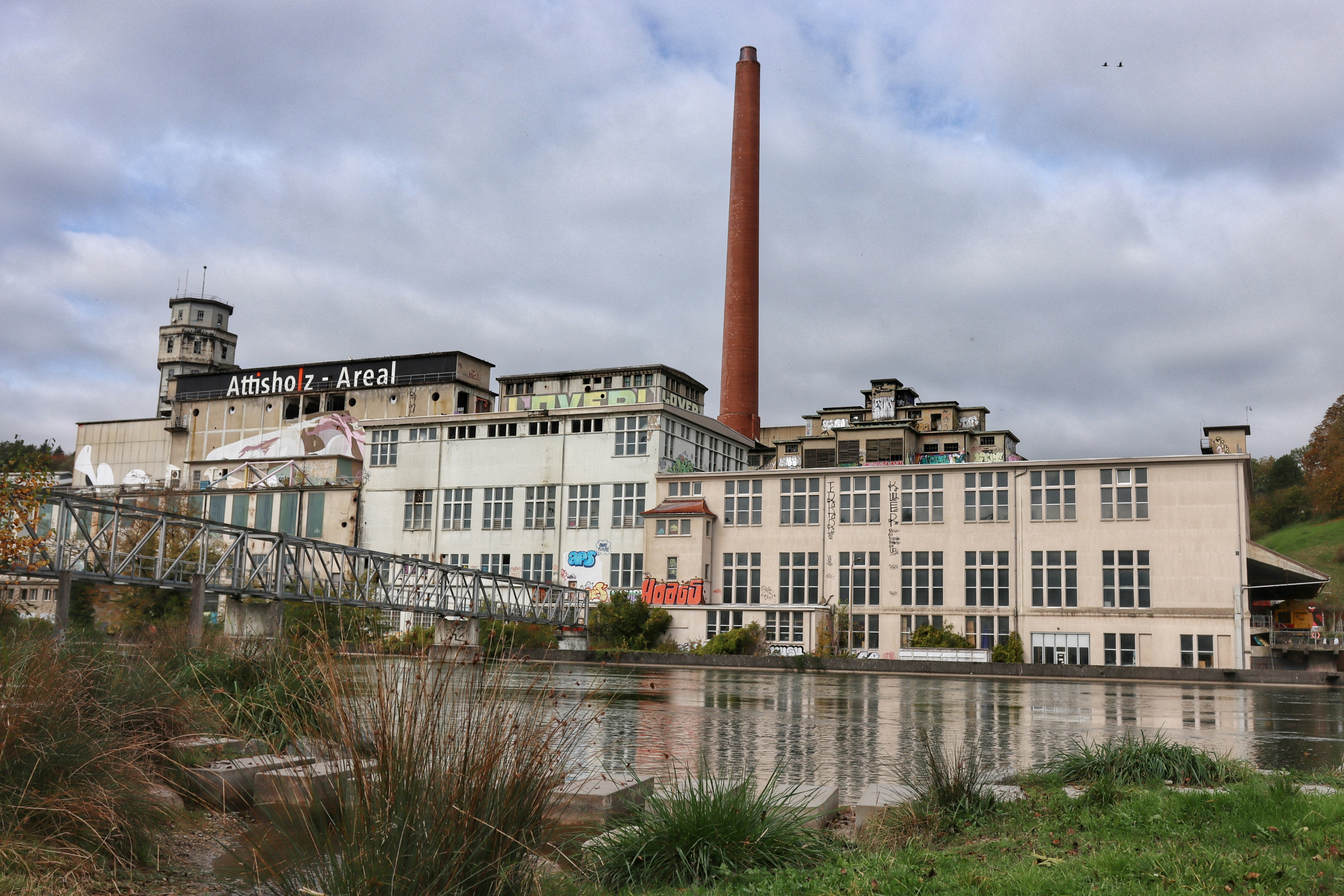 A factory with a river running through it