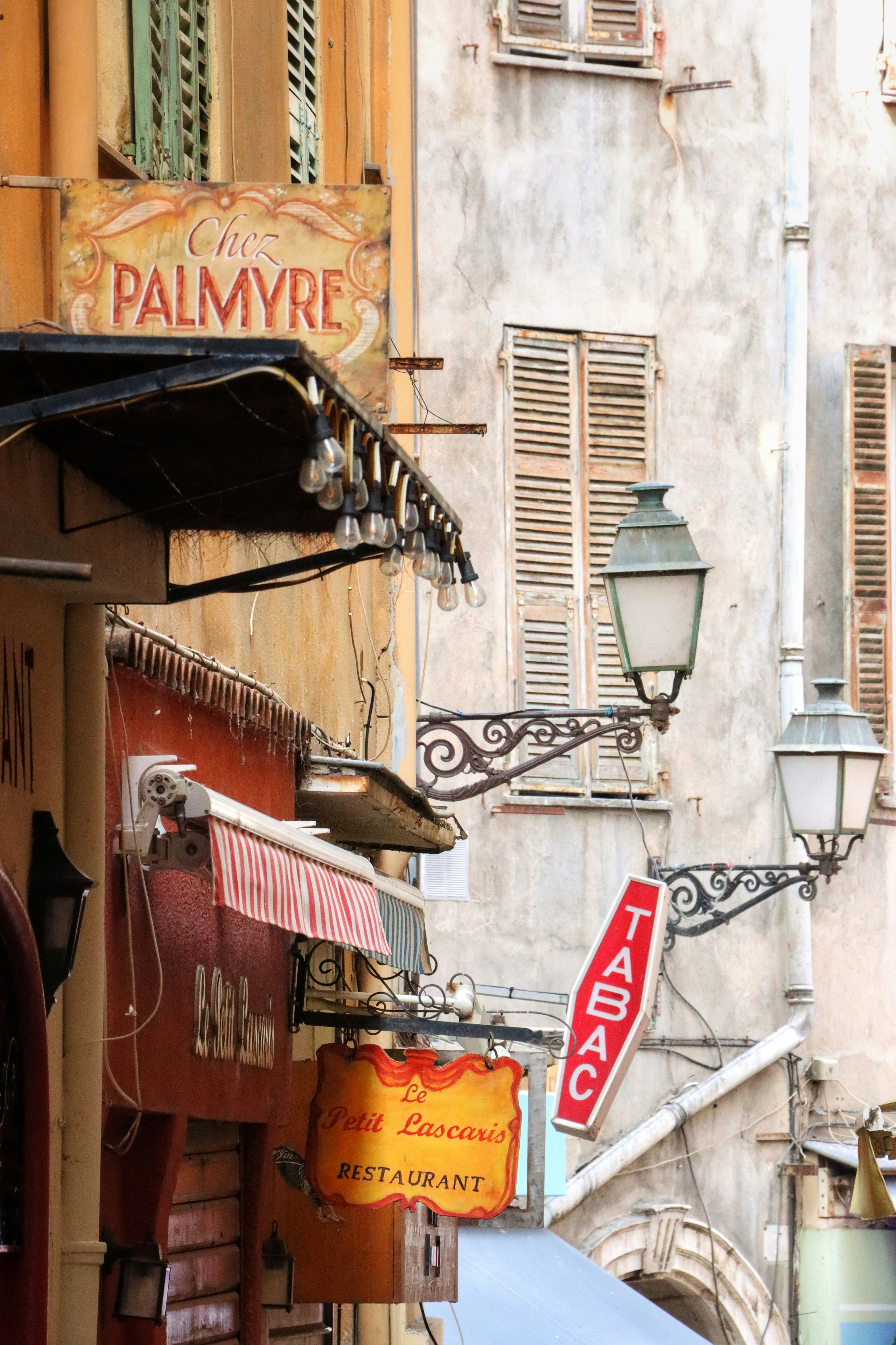 A city street with buildings and signs on the side of it