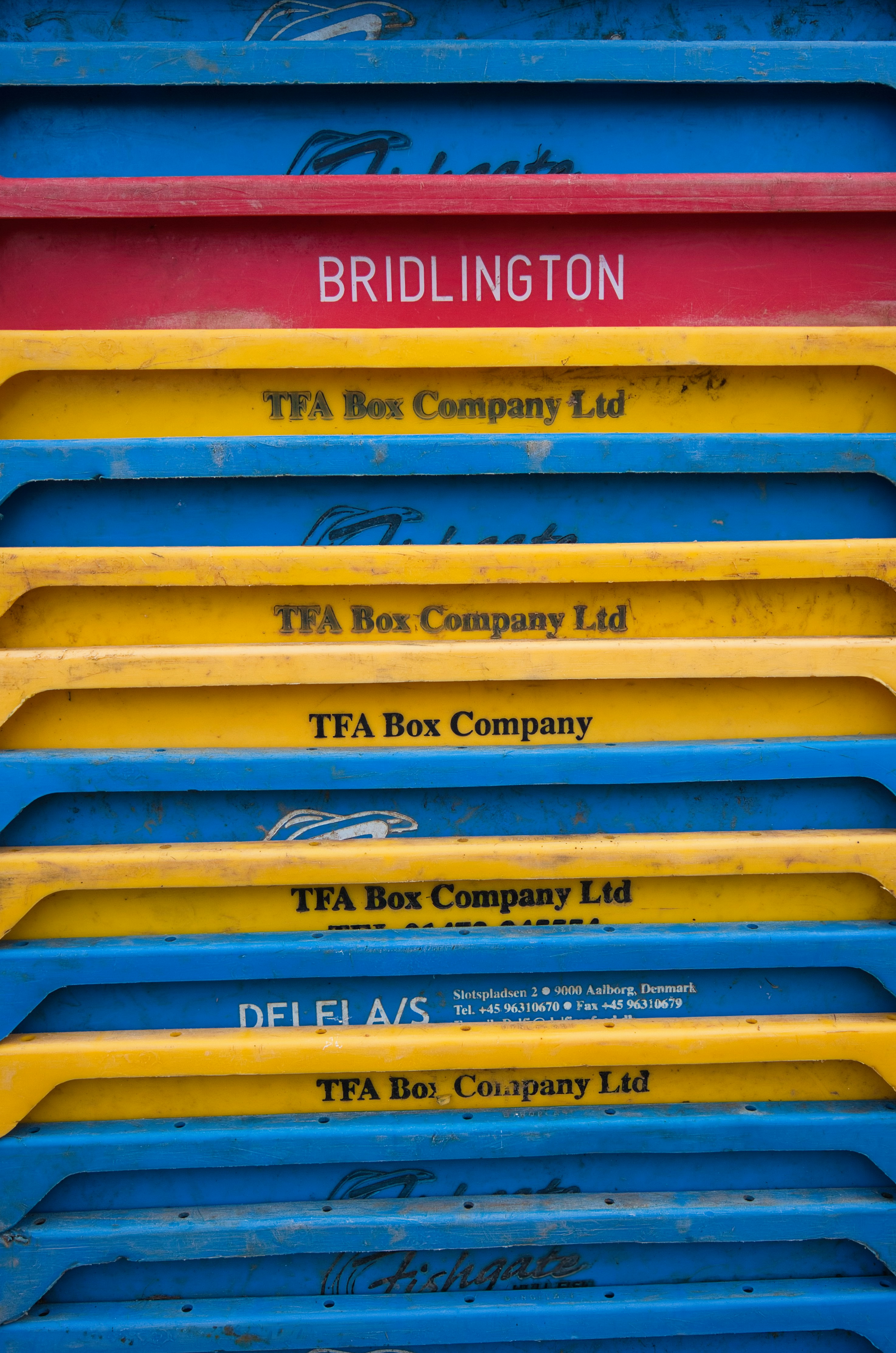 A stack of blue, yellow, red, and yellow boxes