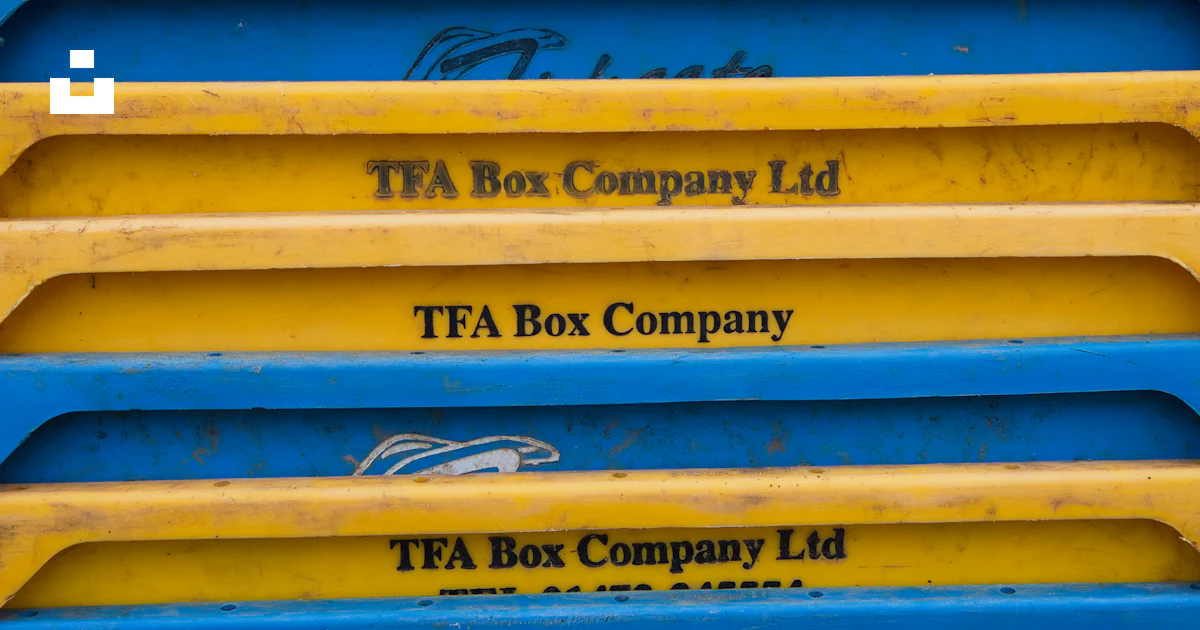 A stack of blue, yellow, red, and yellow boxes photo – Free Colors ...