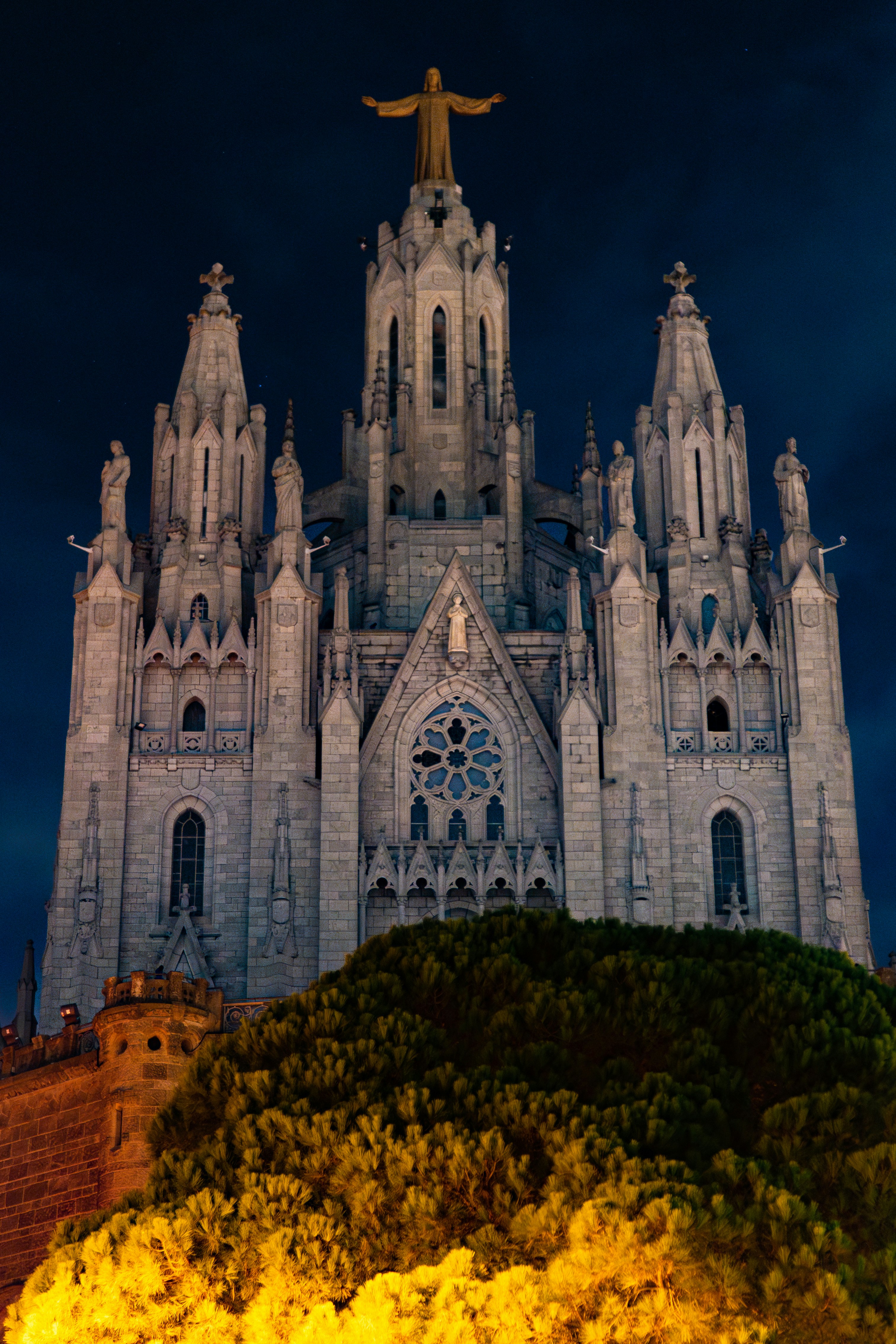 A large cathedral with a statue on top of it