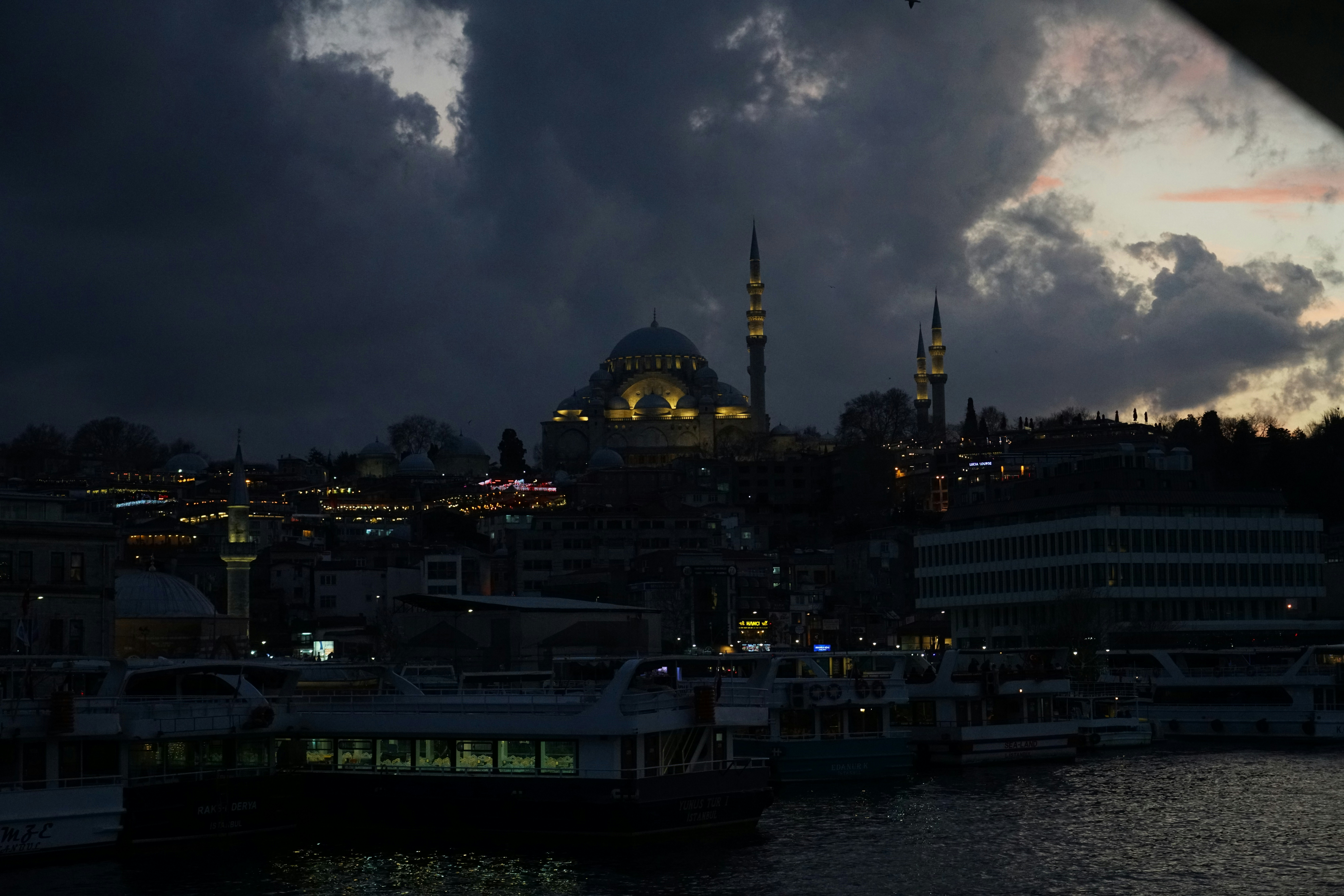 A large body of water with a city in the background