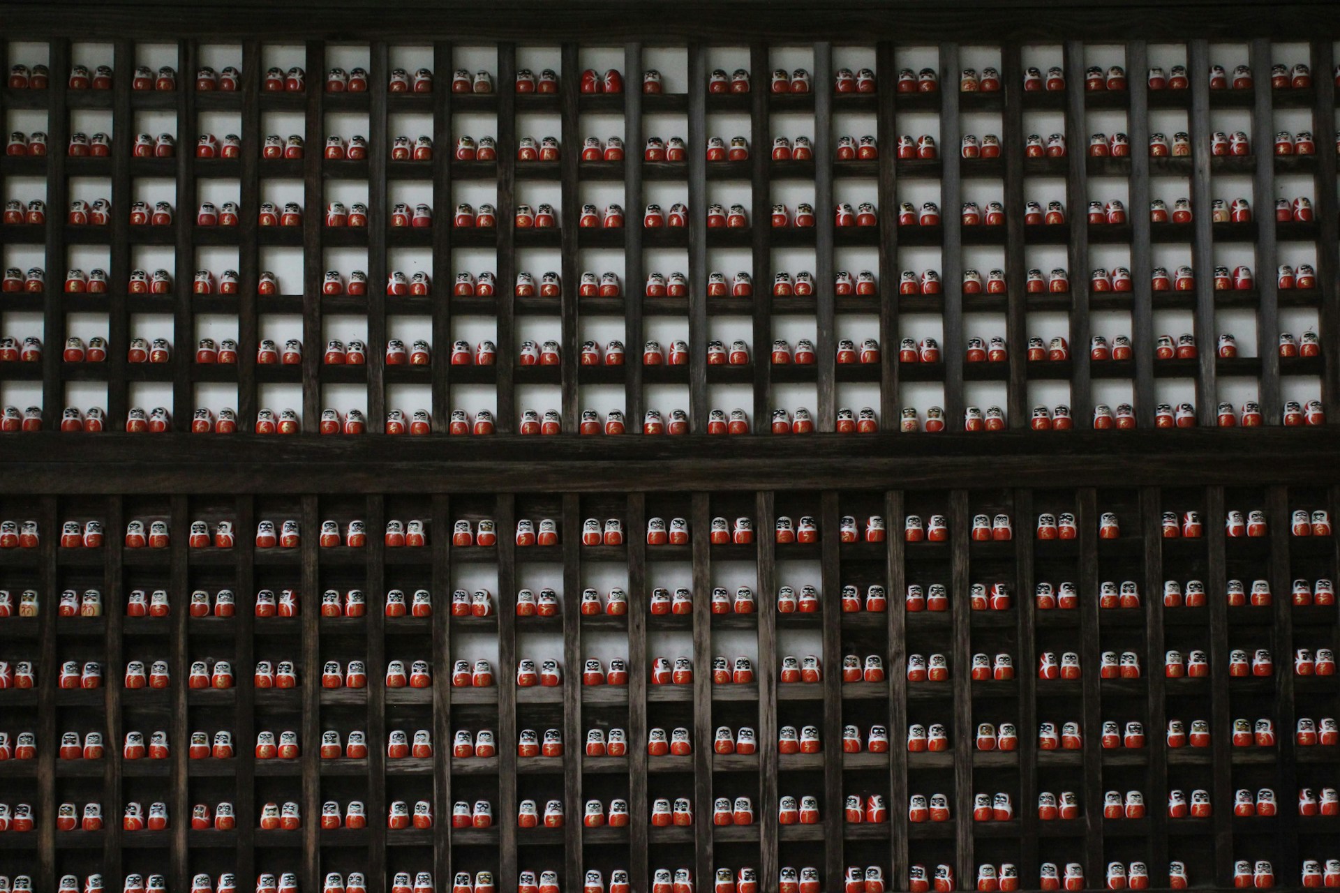 A close up of a wall with a lot of red lights