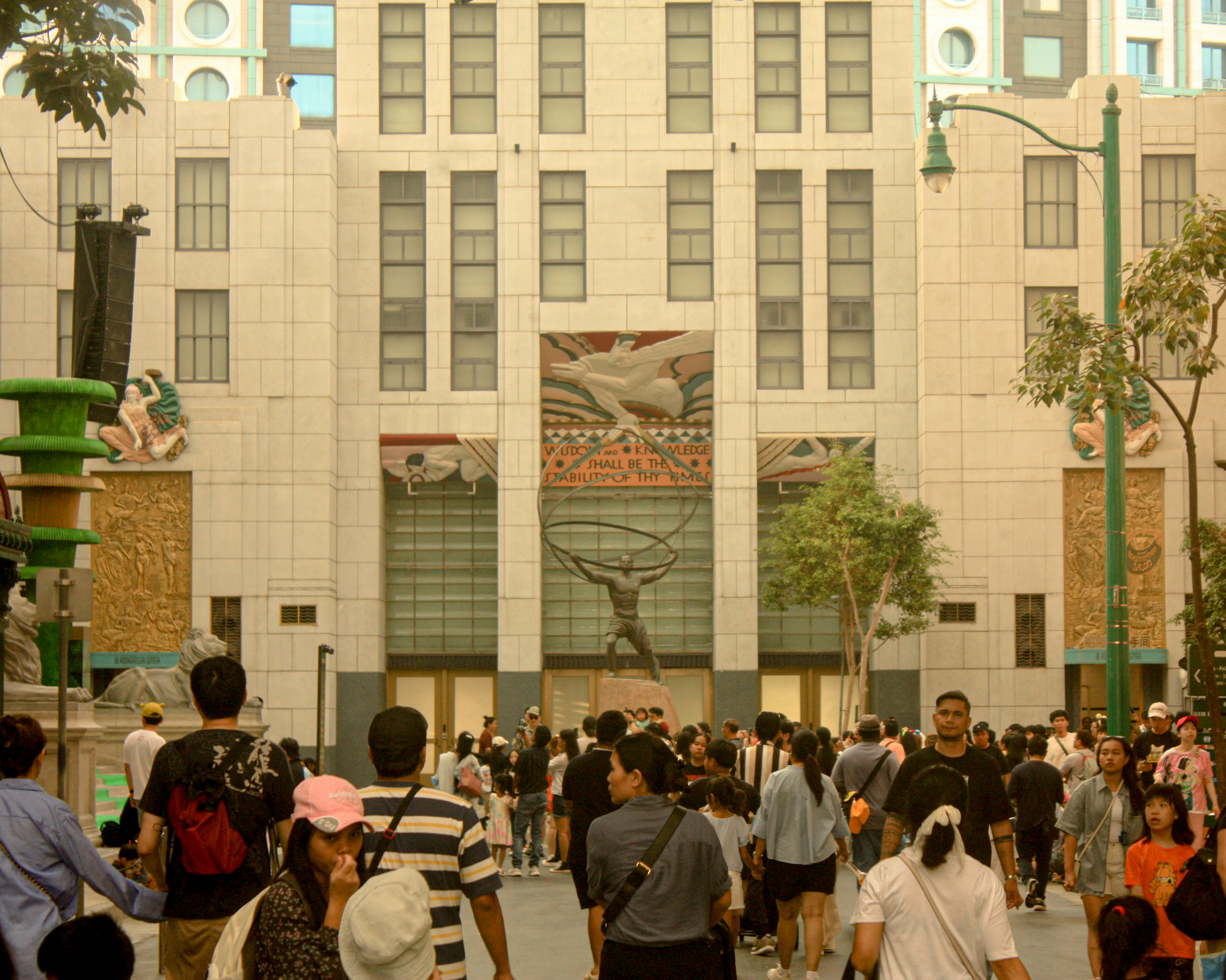 A large group of people walking in front of a building