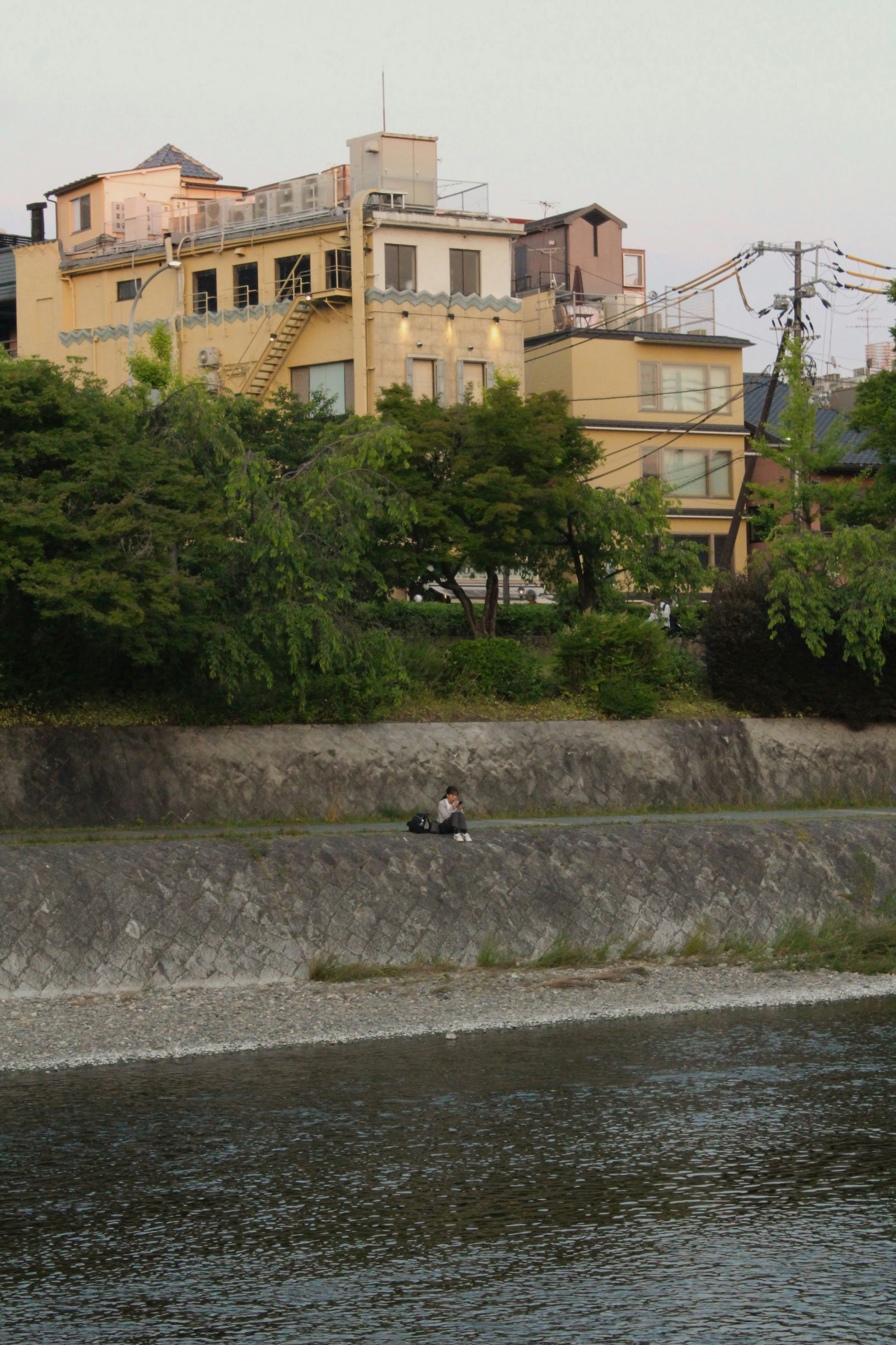 A man riding a surfboard on top of a body of water