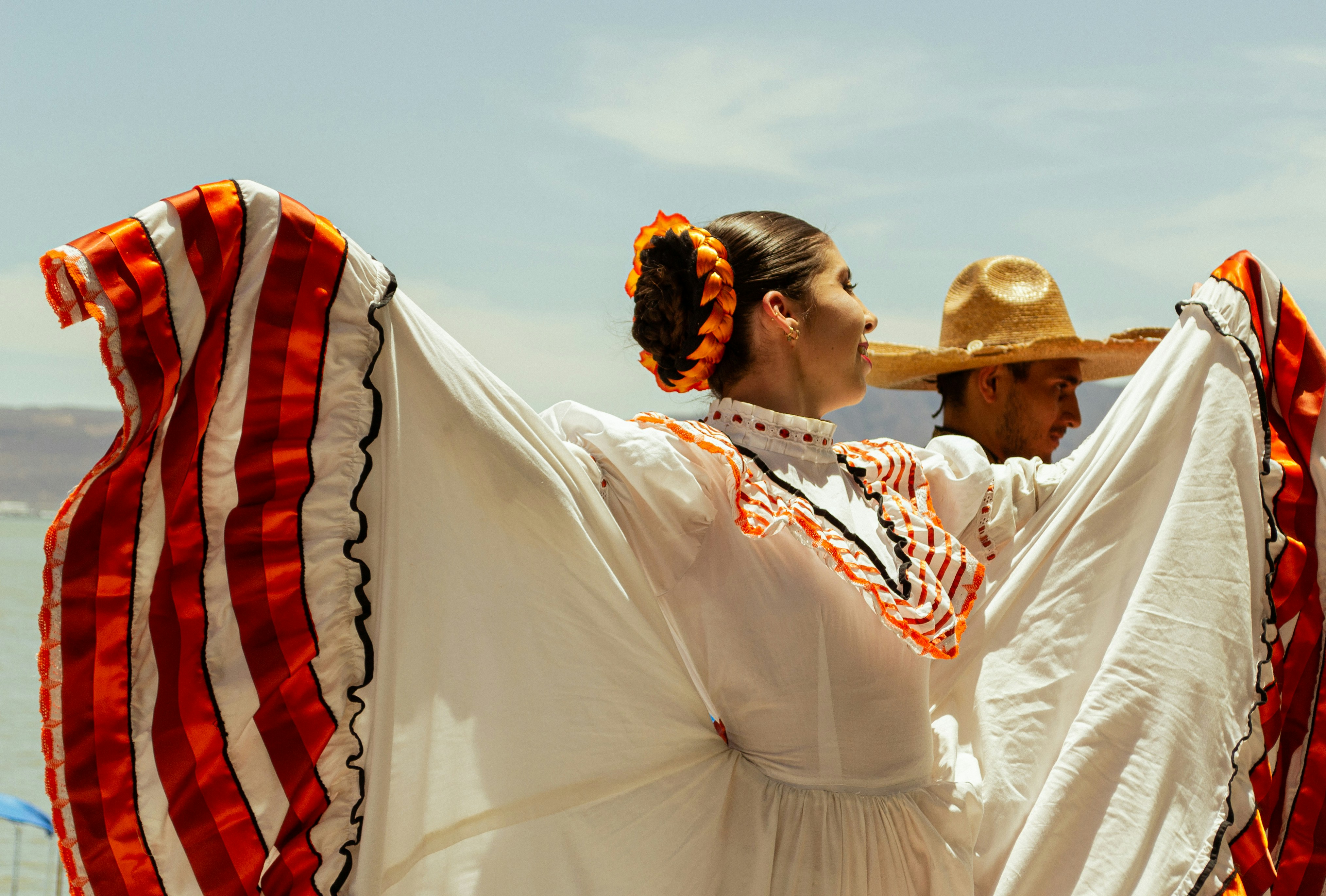 A man and a woman dressed in mexican clothing