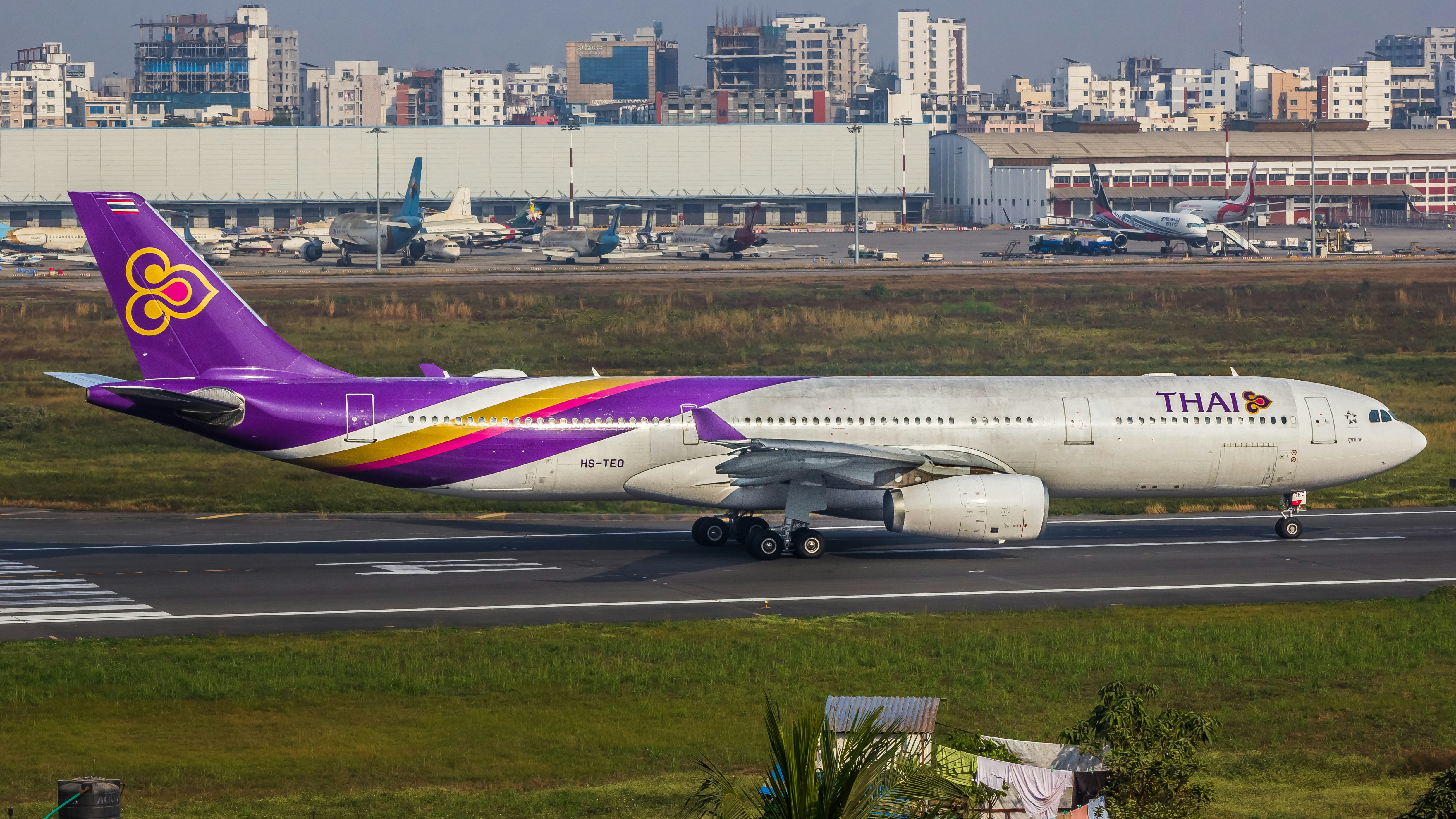 A large jetliner sitting on top of an airport runway