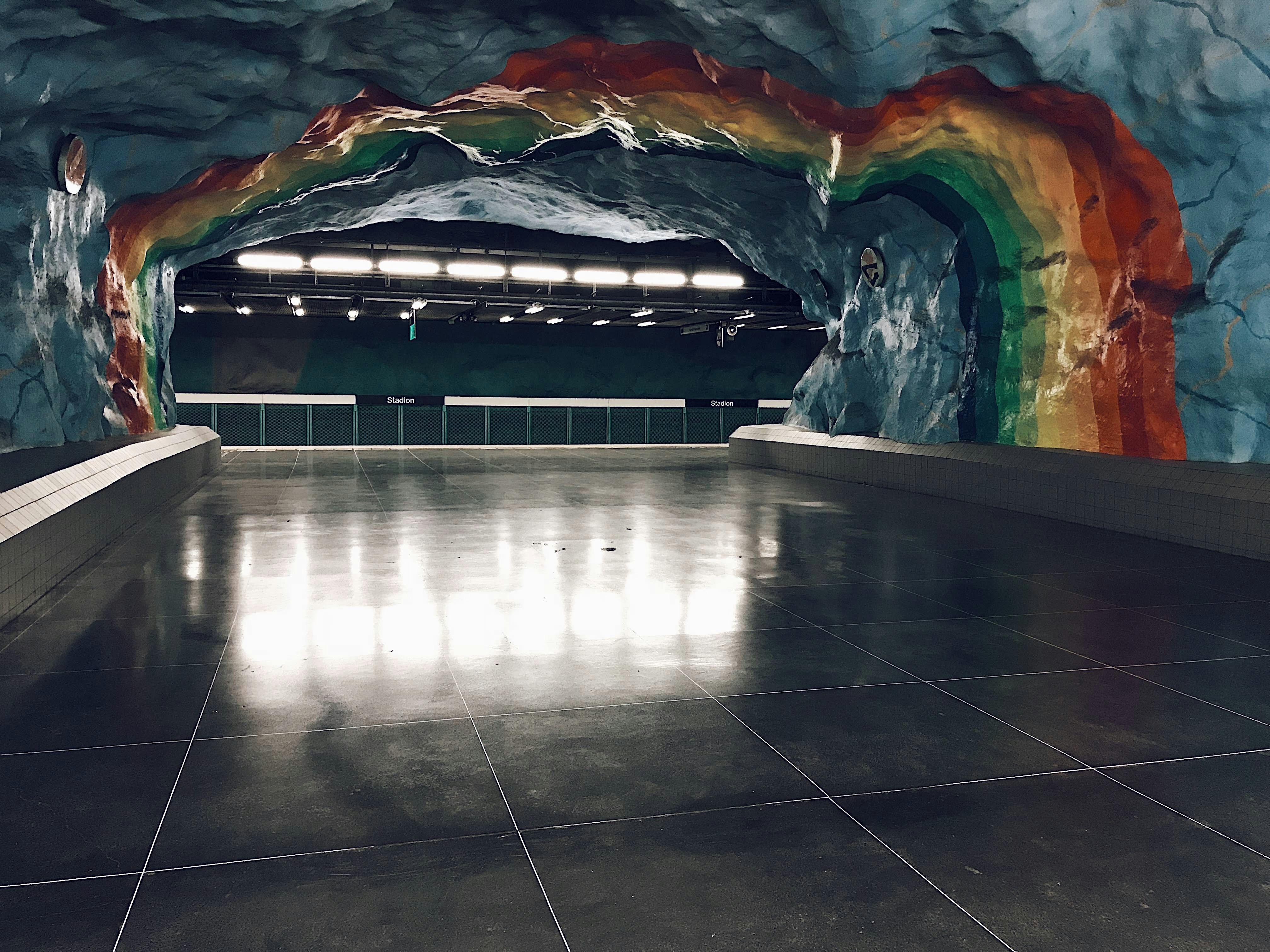 A large room with a rainbow painted on the wall