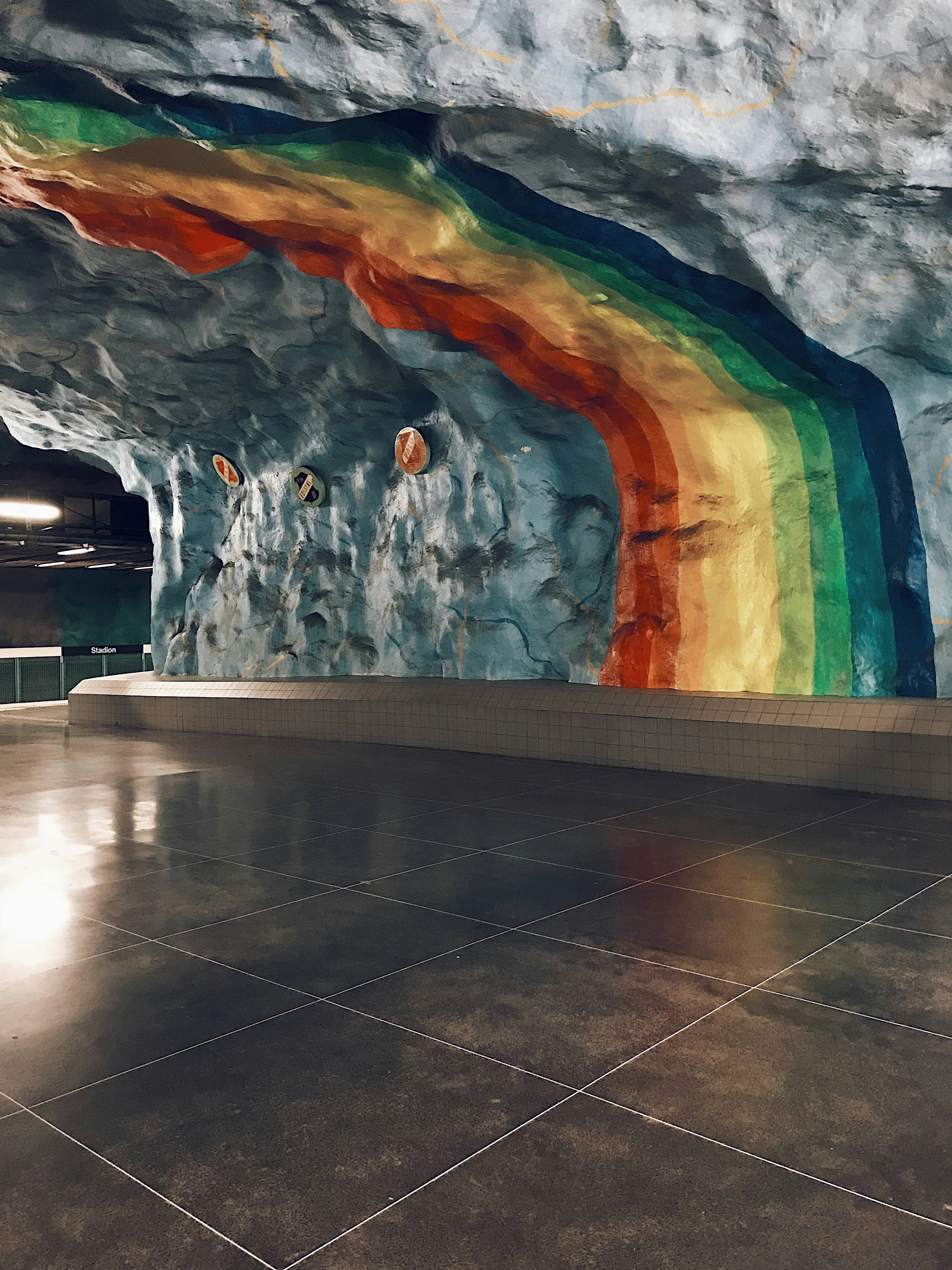 A room with a rainbow painted on the wall