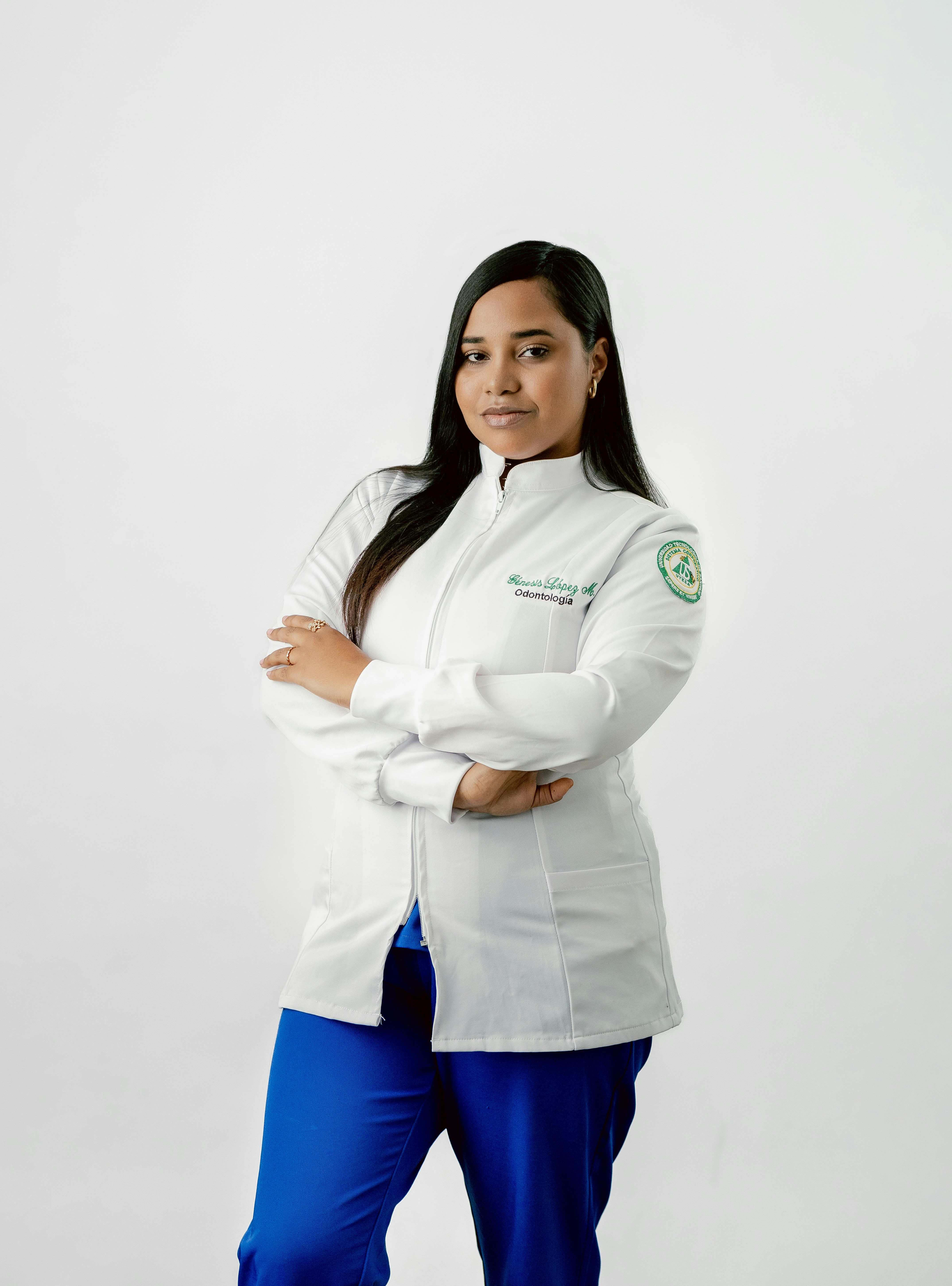 A woman in a white jacket and blue pants