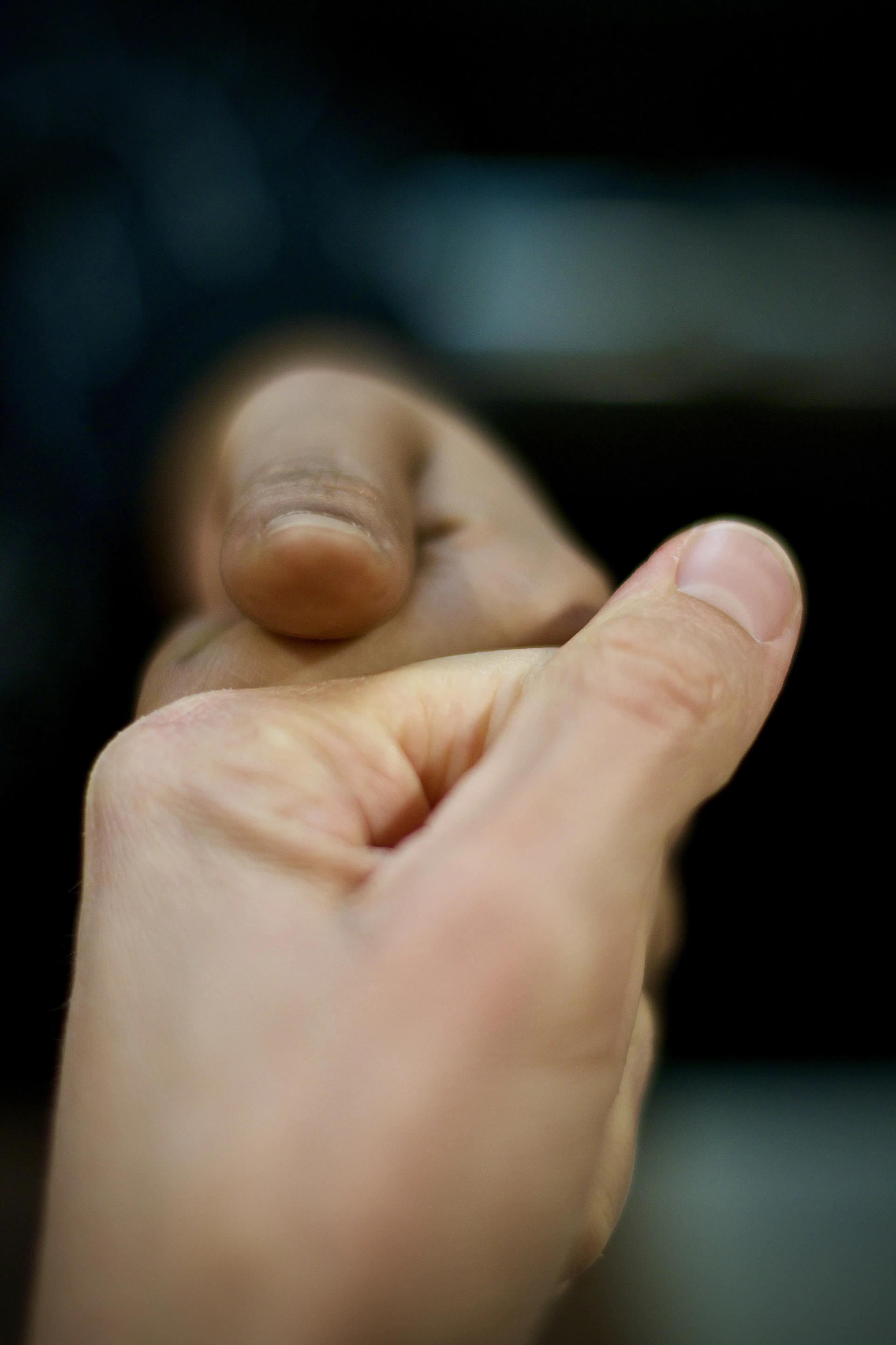 A close up of a person holding something in their hand