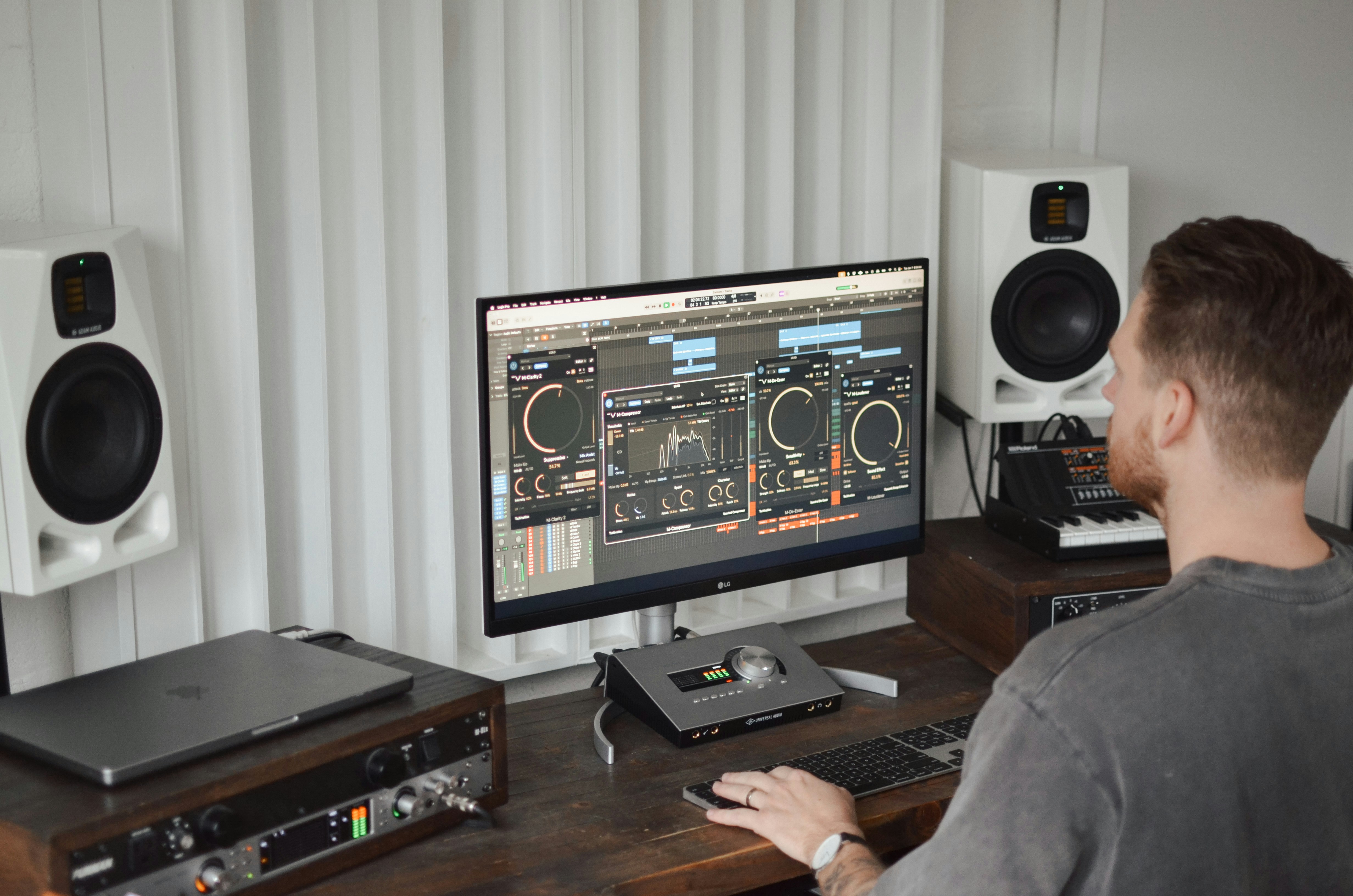 A man sitting at a desk in front of a computer