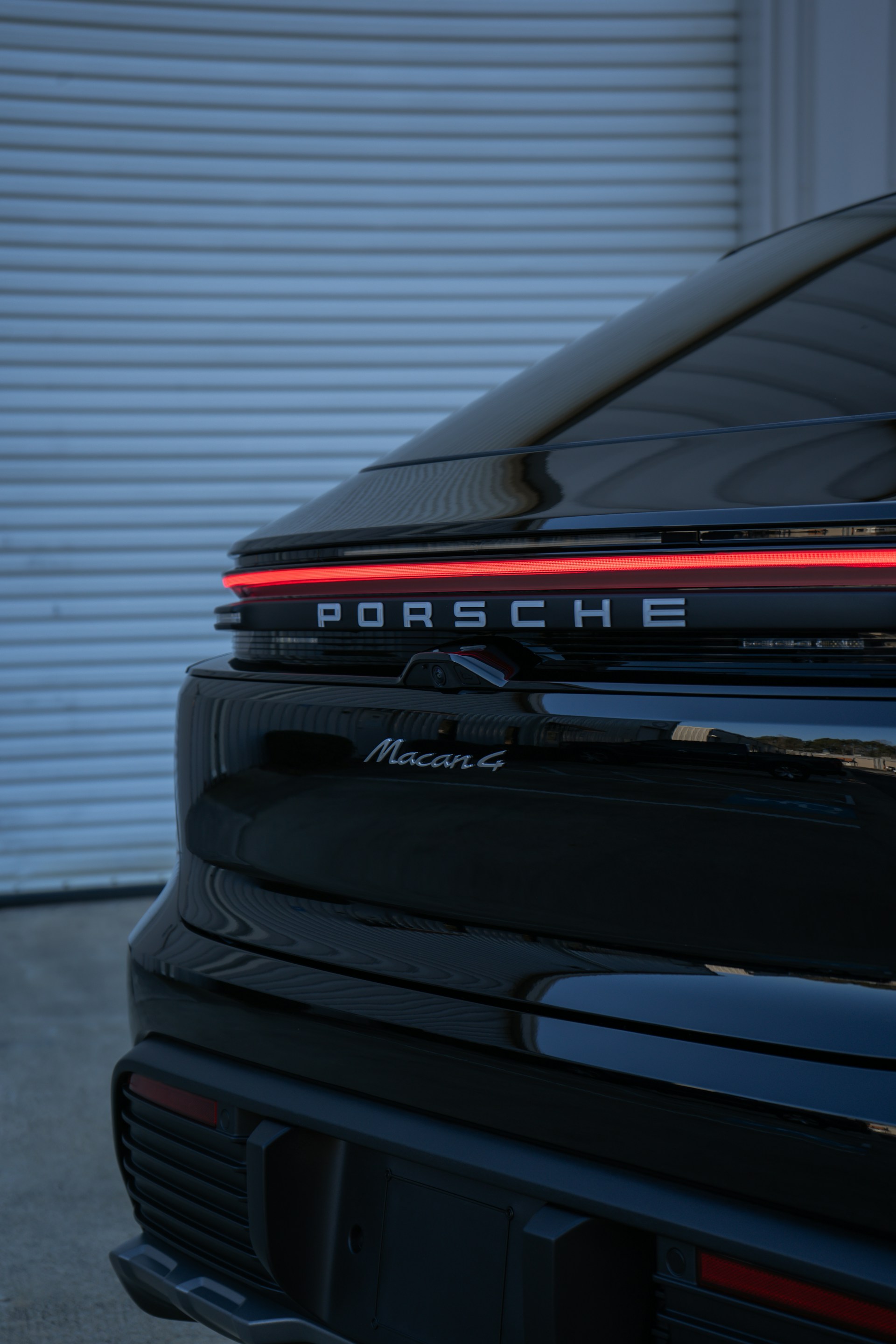 A porsche parked in front of a garage