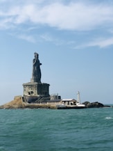 The statue of liberty is in the middle of the ocean