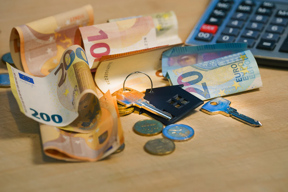 Money and calculator representing a consumer loan