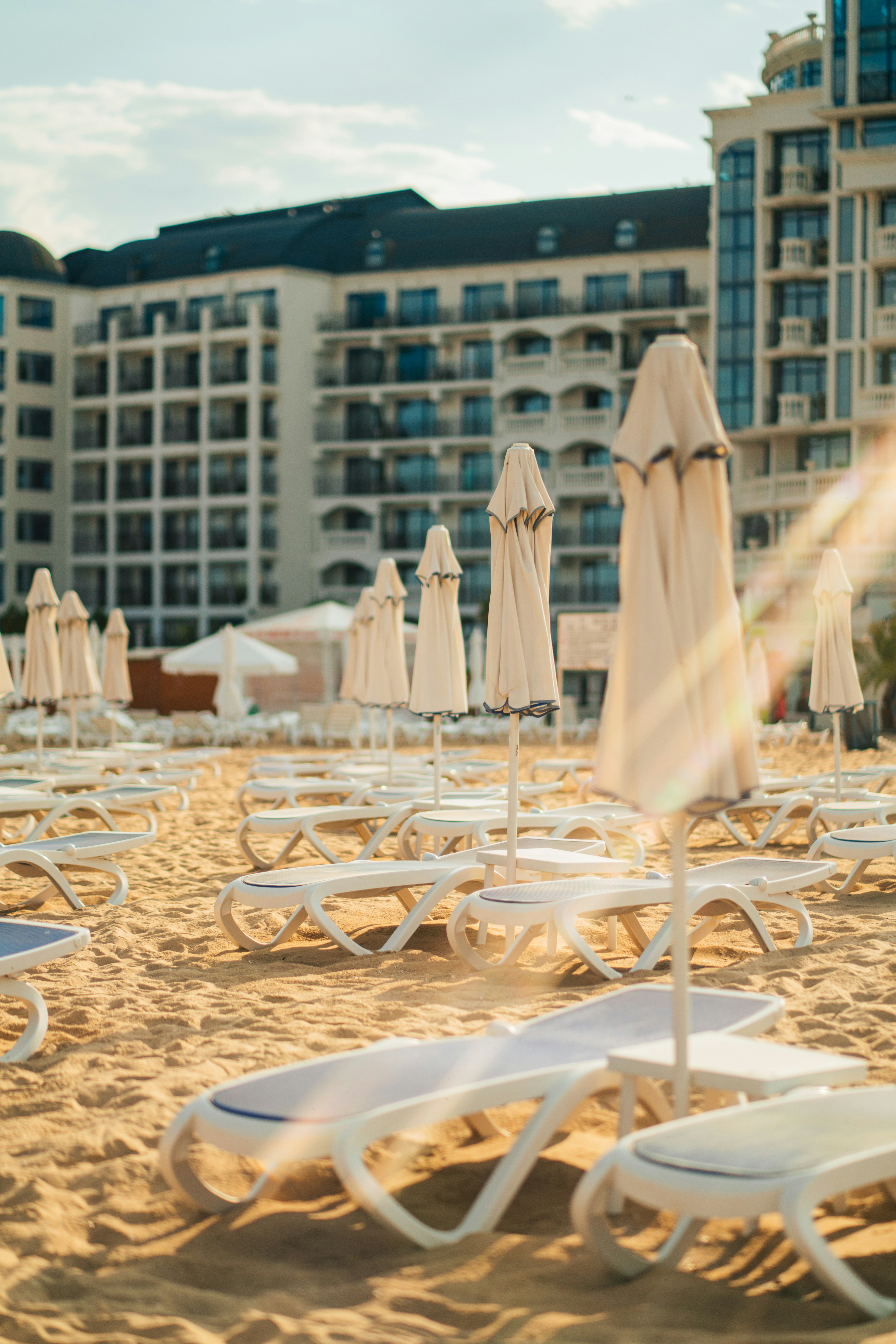 A bunch of chairs and umbrellas on a beach